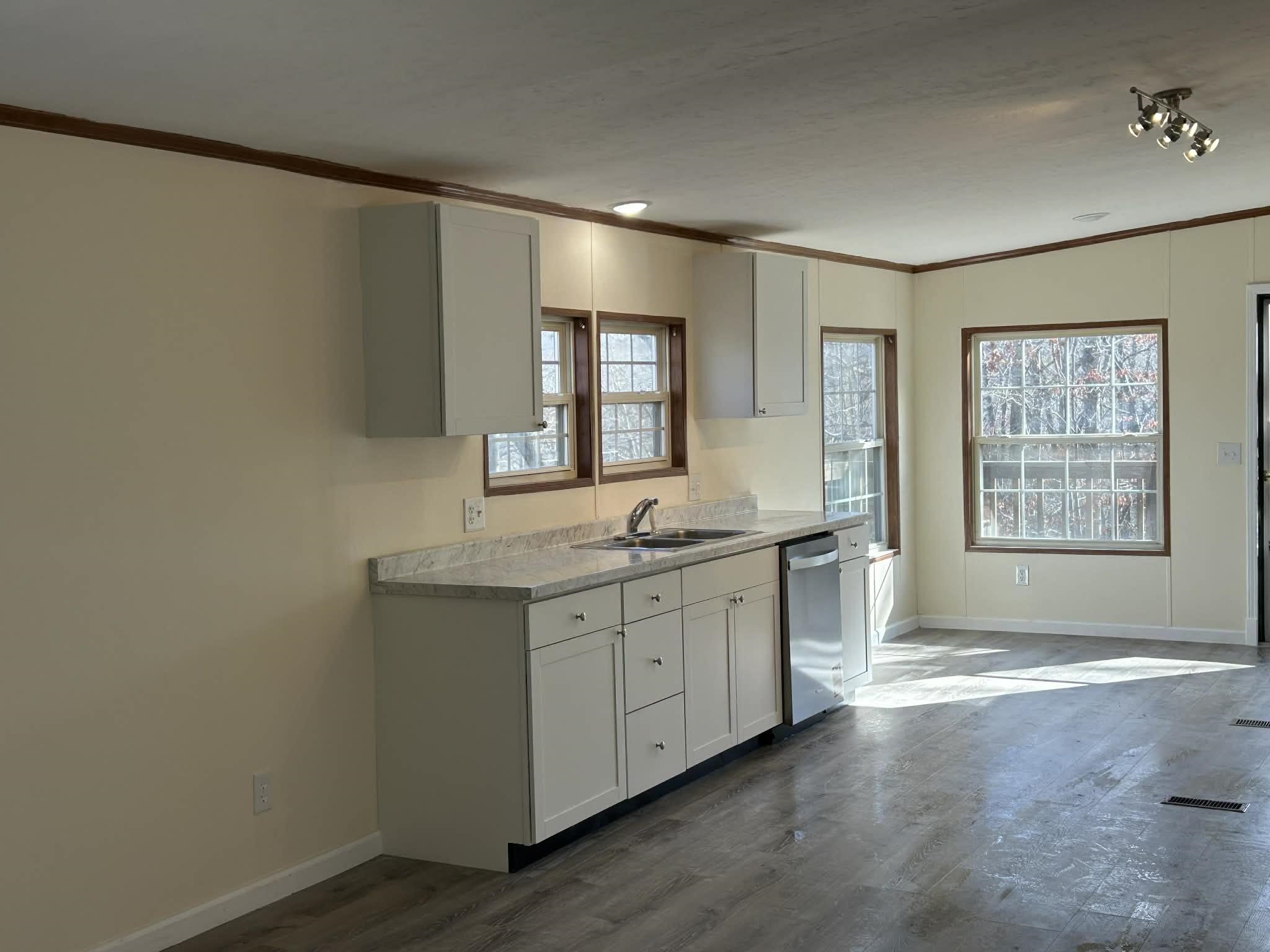104 Bentwood Drive Blue Ridge, VA 24064 - Photo 17 of 19 a spacious bathroom with a granite countertop sink and a bathtub