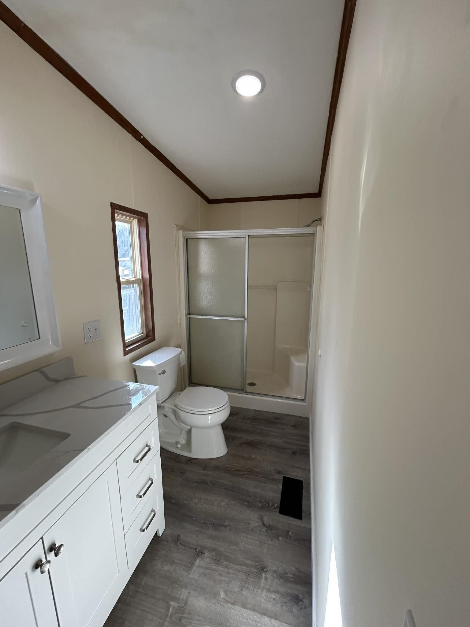 104 Bentwood Drive Blue Ridge, VA 24064 - Photo 18 of 19 a spacious bathroom with a double vanity sink and a mirror