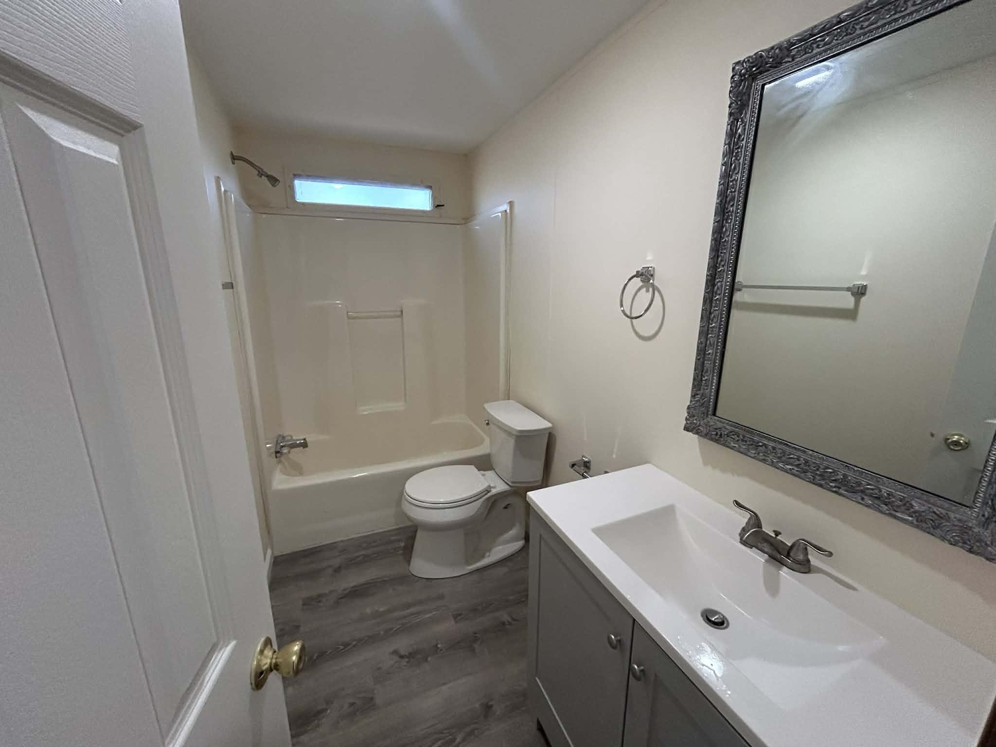 104 Bentwood Drive Blue Ridge, VA 24064 - Photo 8 of 19 a bathroom with a sink and mirror with toilet
