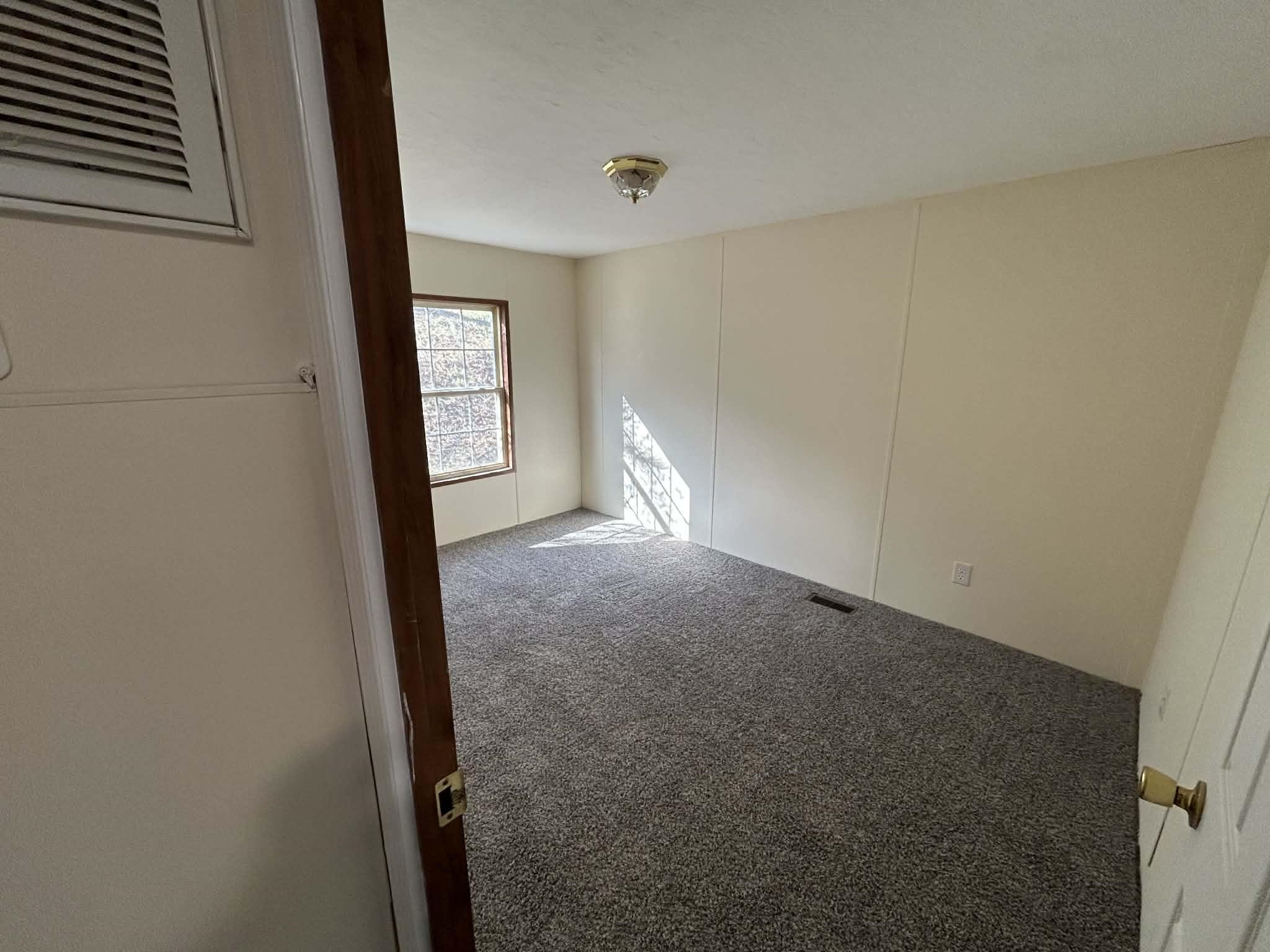 104 Bentwood Drive Blue Ridge, VA 24064 - Photo 9 of 19 a view of empty room with windows