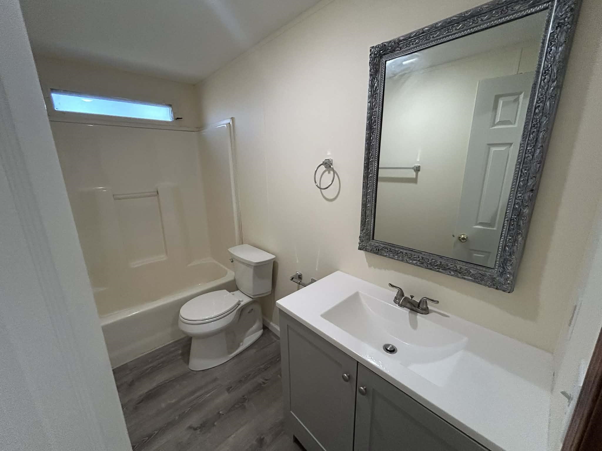 104 Bentwood Drive Blue Ridge, VA 24064 - Photo 10 of 19 a bathroom with a sink and a mirror