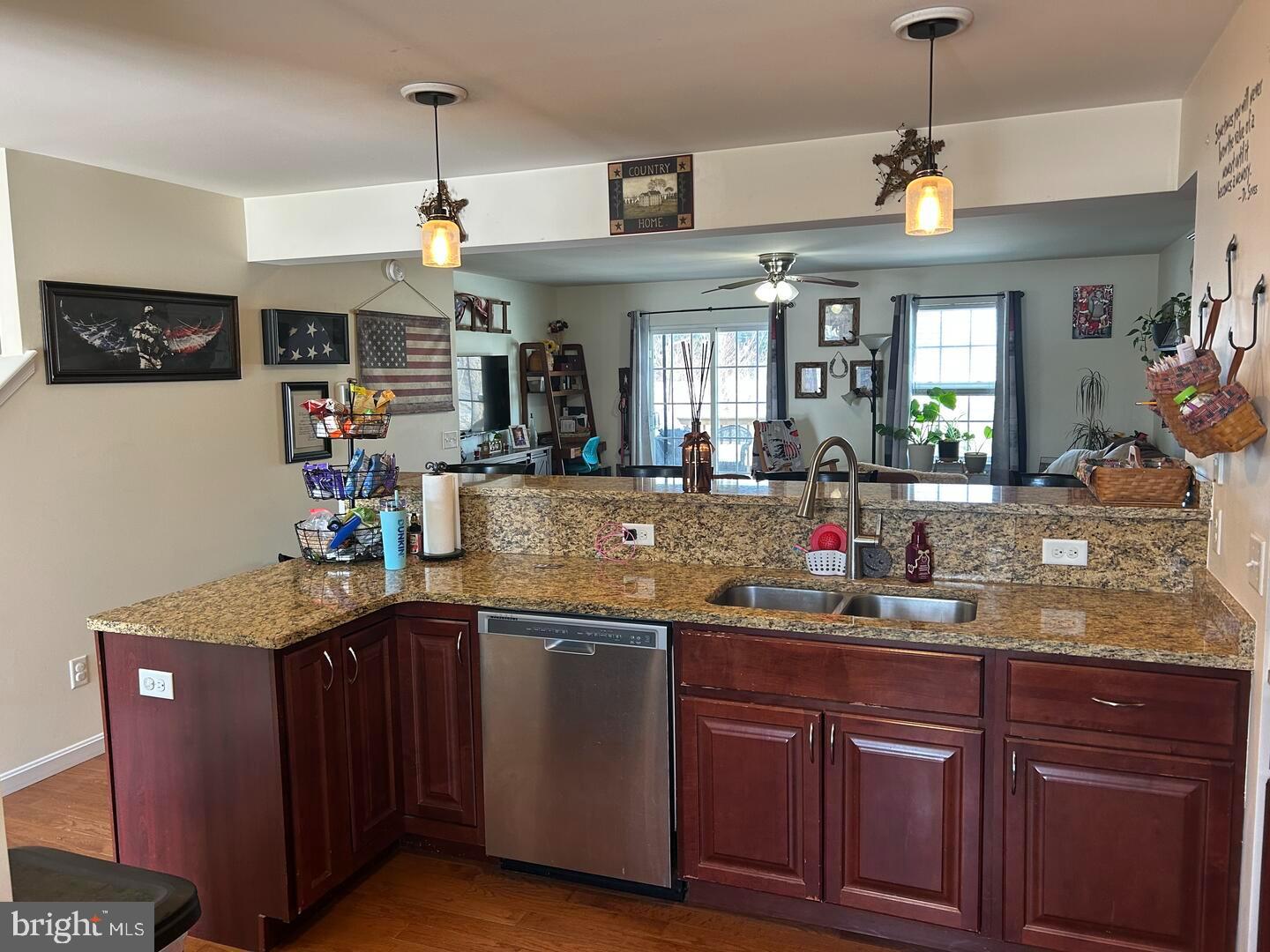 169 Medal Way Magnolia, DE 19962 - Photo 4 of 13 a kitchen with kitchen island granite countertop a sink cabinets and window