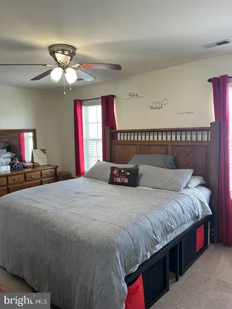 a bedroom with a bed and chandelier