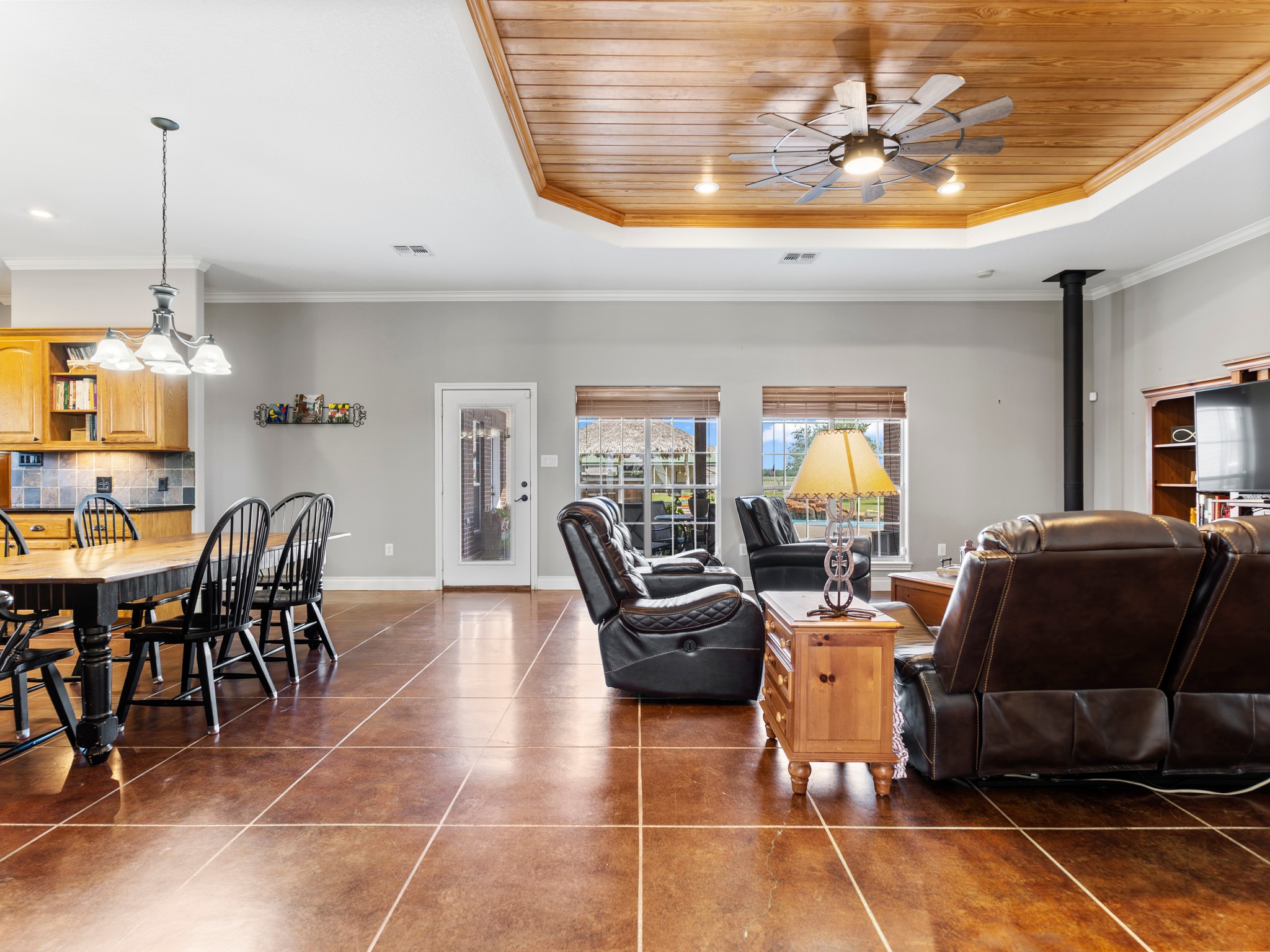 10630 Brinkmeyer Road Needville, TX 77461 - Photo 11 of 50 a living room with furniture a chandelier and a dining table