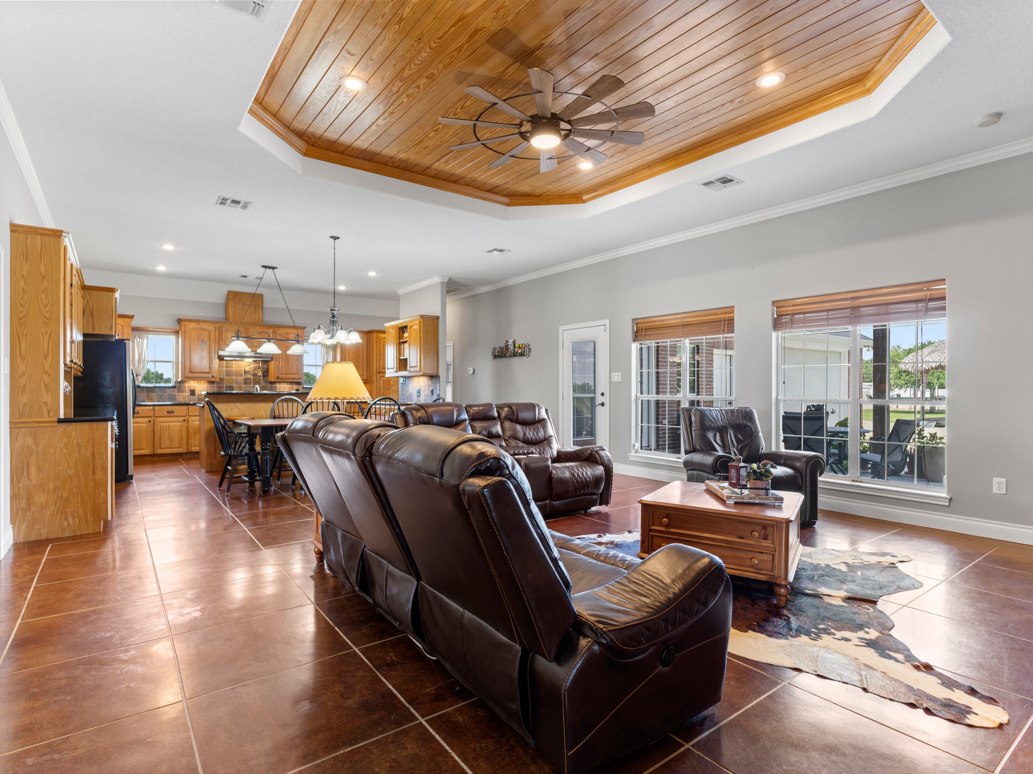 10630 Brinkmeyer Road Needville, TX 77461 - Photo 13 of 50 a living room with lots of furniture and a chandelier