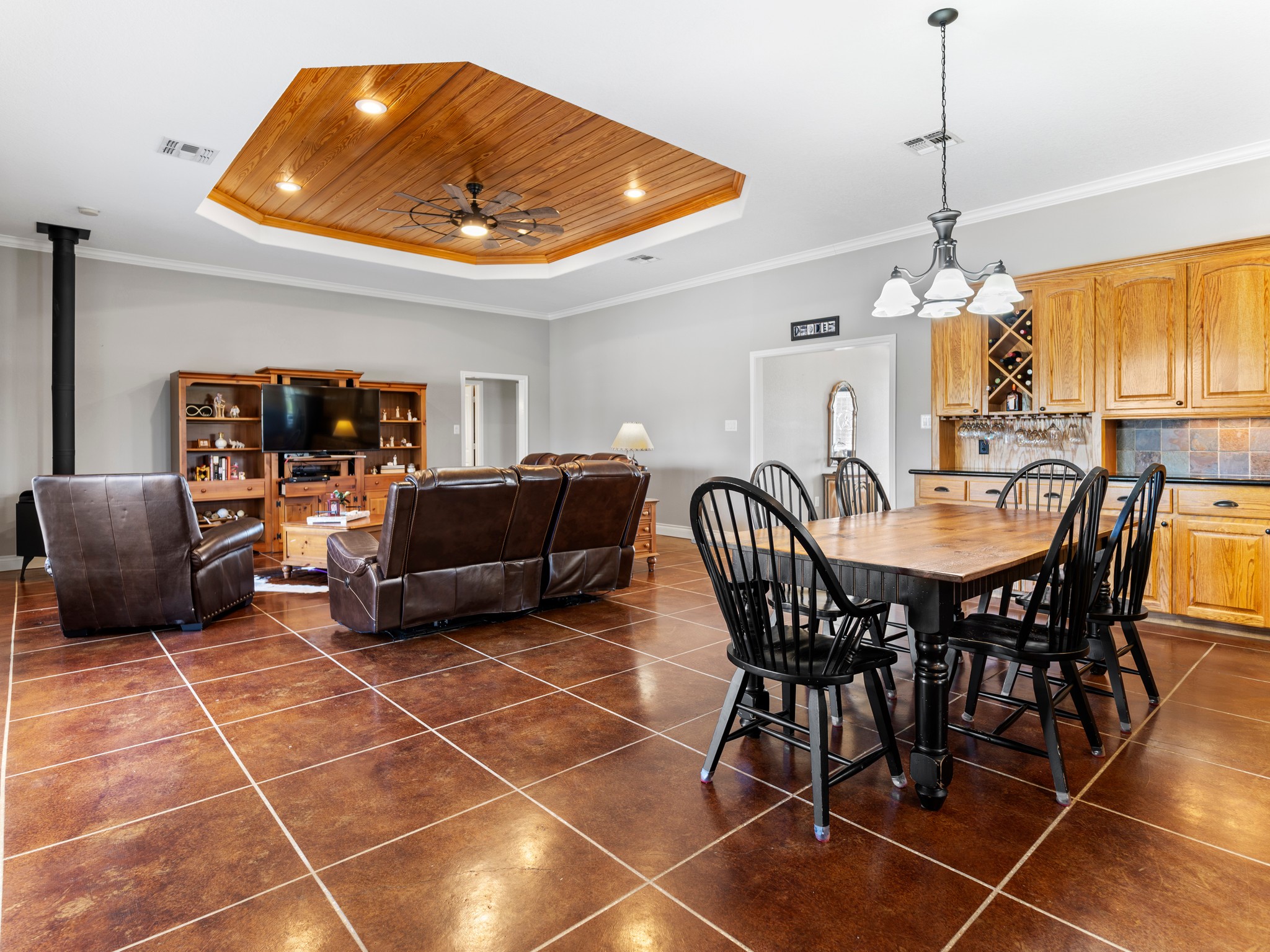 10630 Brinkmeyer Road Needville, TX 77461 - Photo 14 of 50 a living room with furniture a dining table and a chandelier