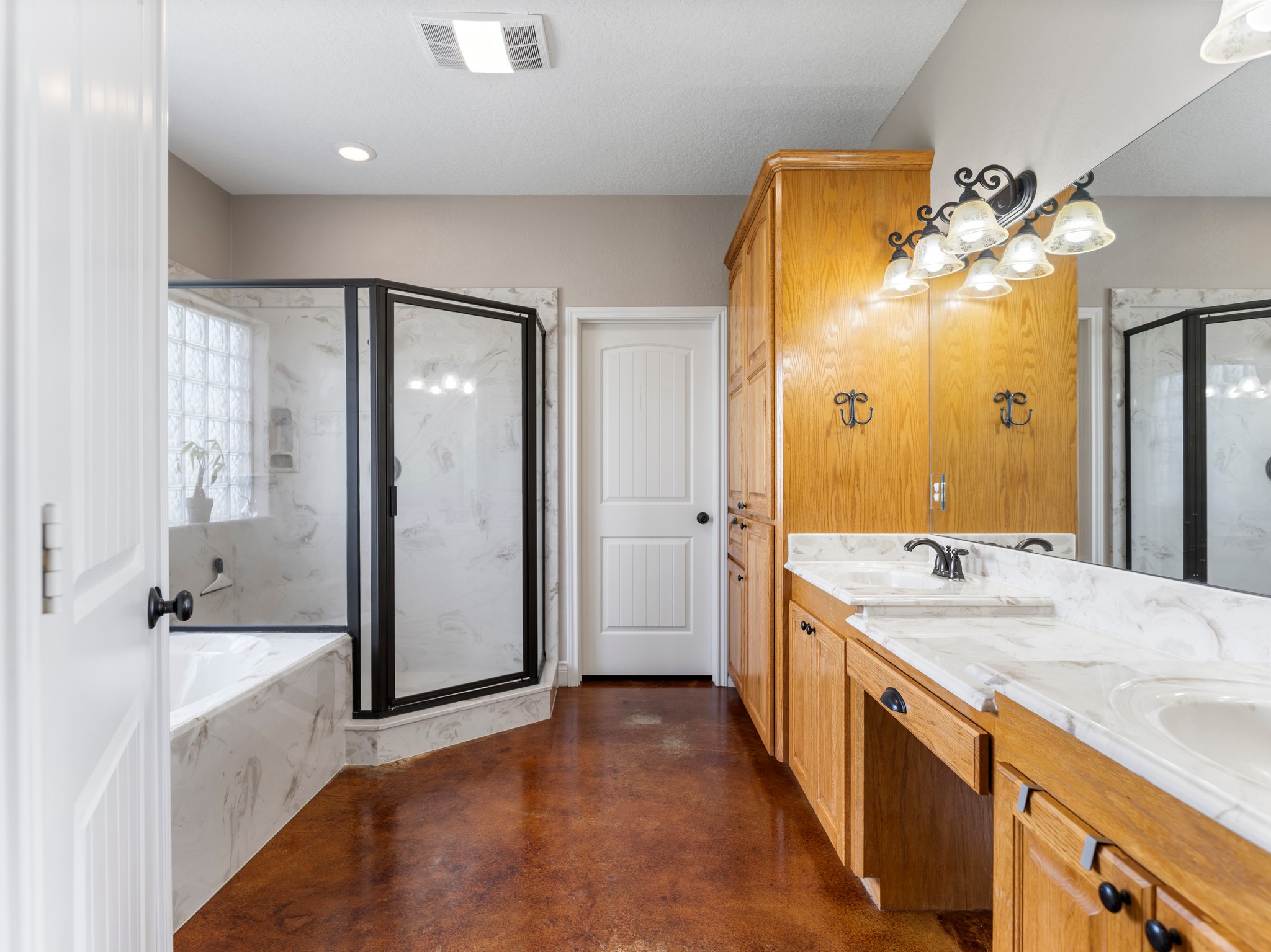 10630 Brinkmeyer Road Needville, TX 77461 - Photo 30 of 50 a spacious bathroom with a tub sink and mirror