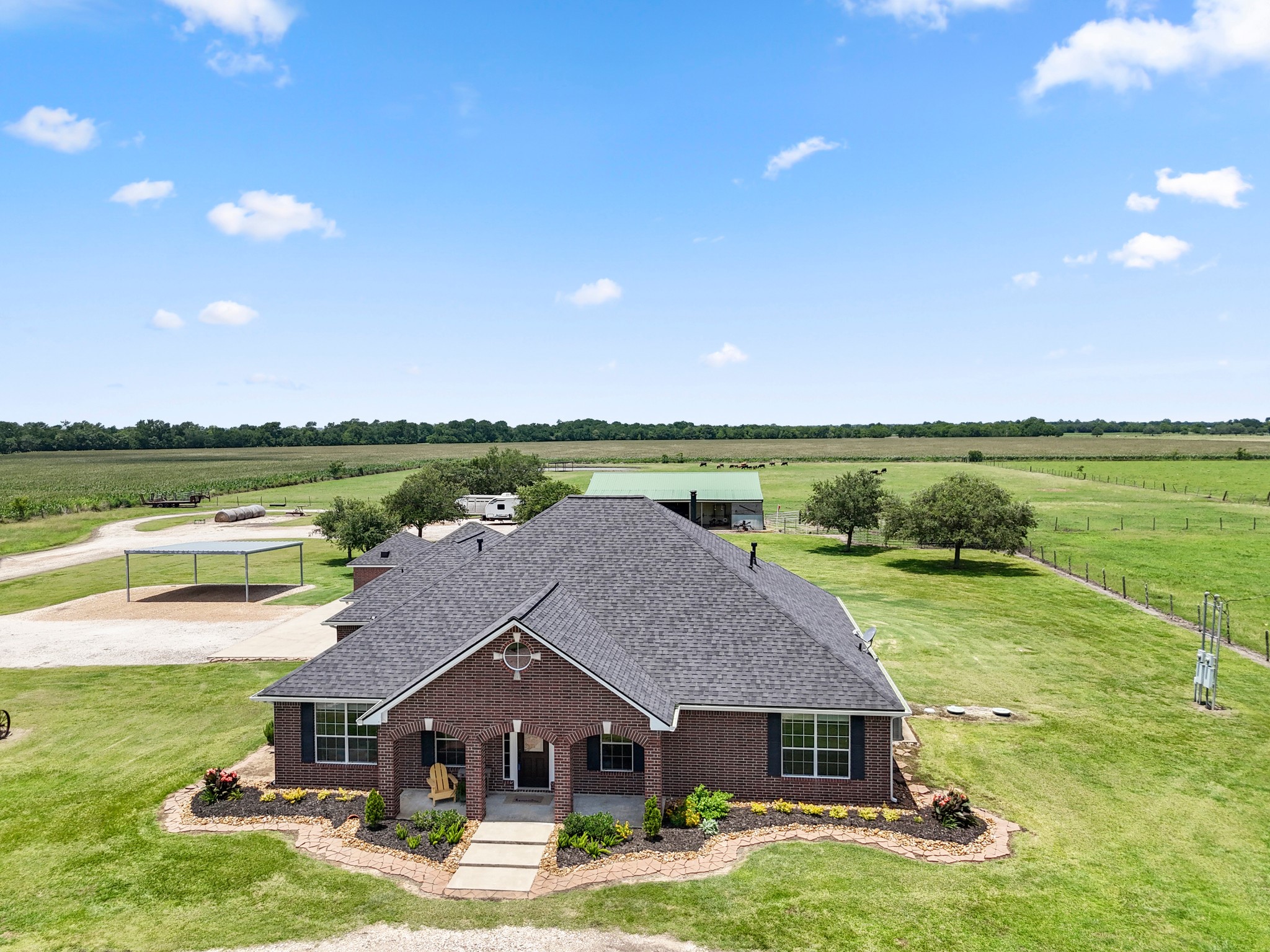 10630 Brinkmeyer Road Needville, TX 77461 - Photo 3 of 50 an aerial view of a house with big yard and large trees