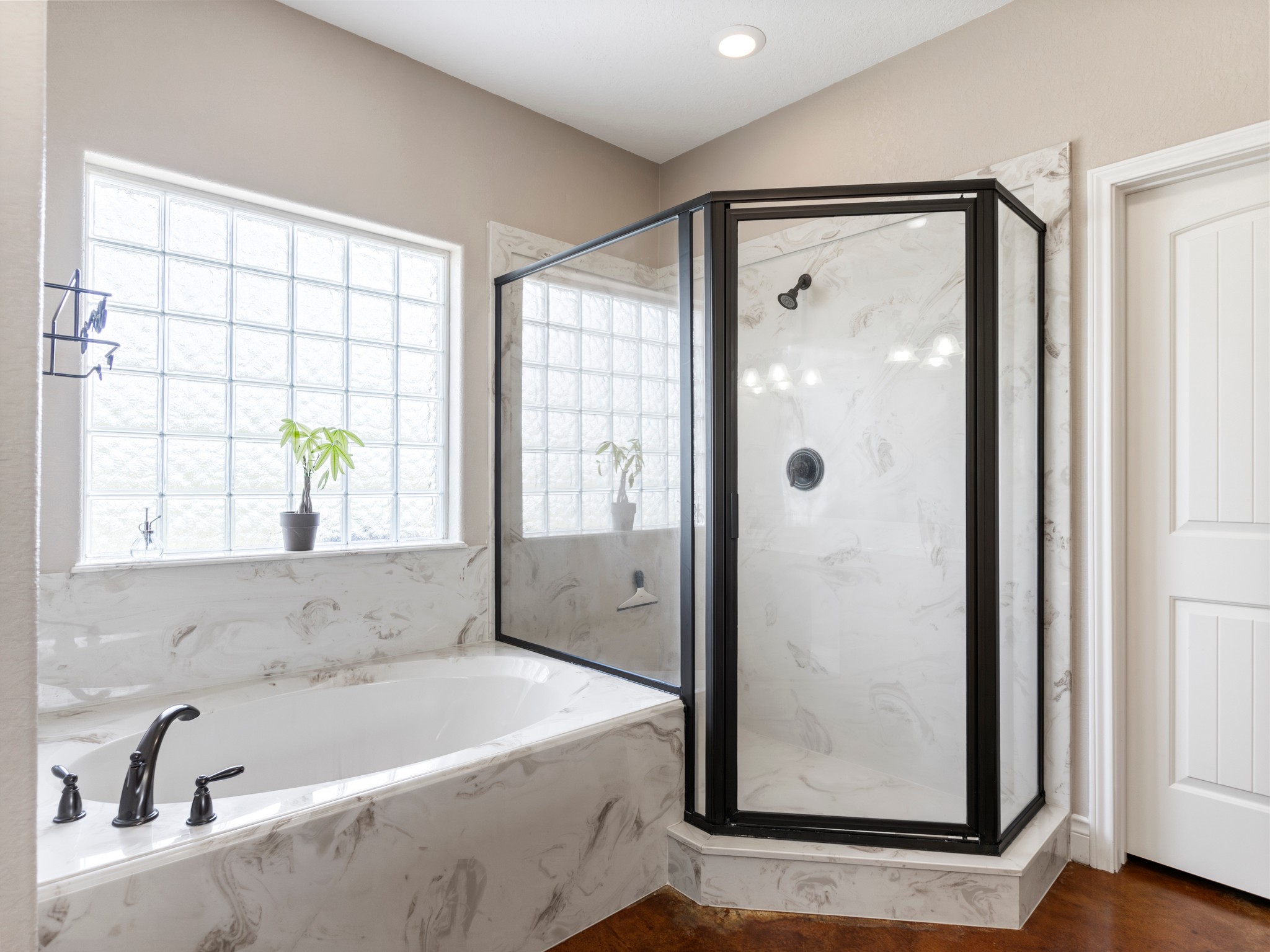 10630 Brinkmeyer Road Needville, TX 77461 - Photo 32 of 50 a bathroom with a bathtub and a shower