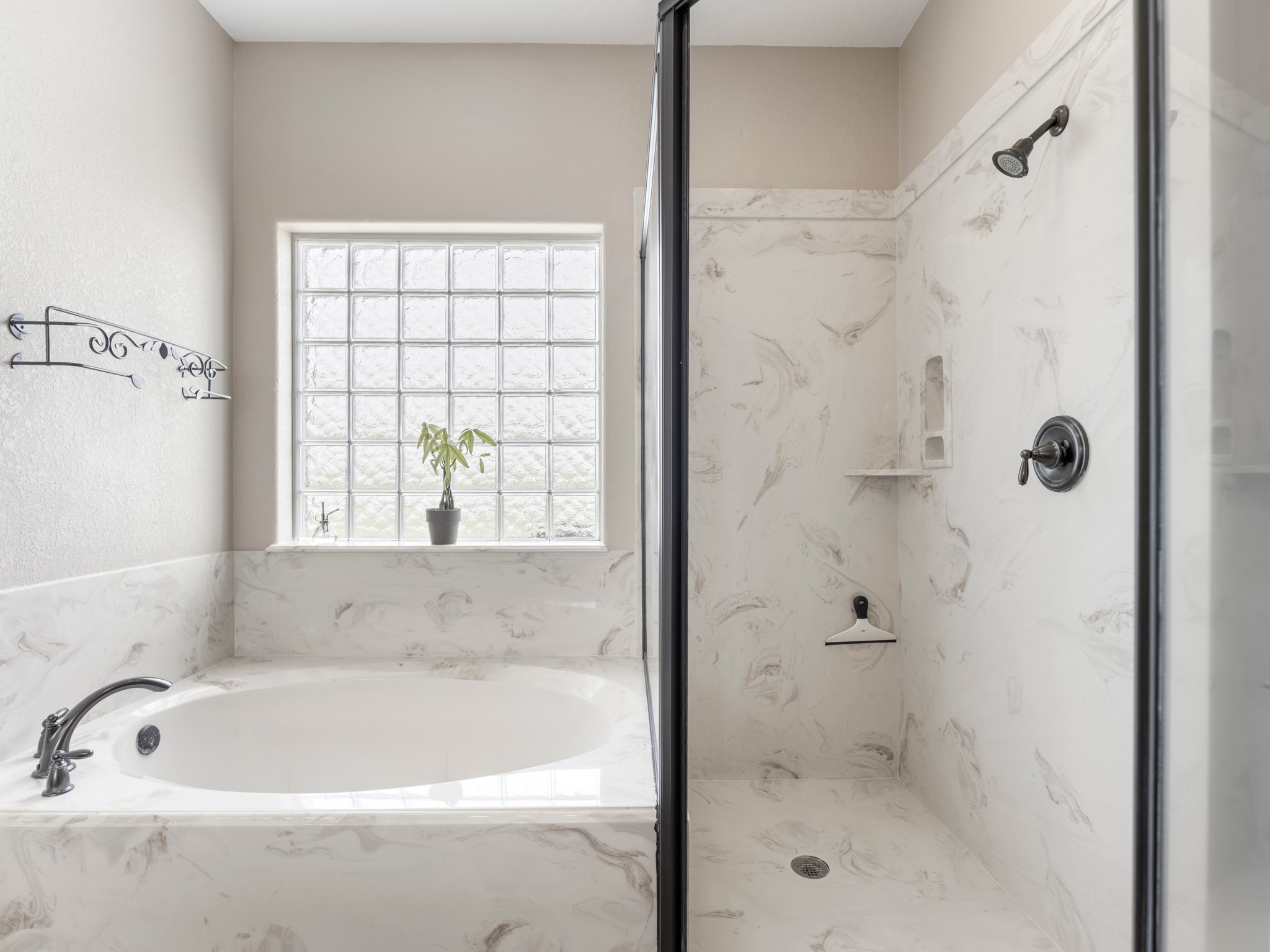 10630 Brinkmeyer Road Needville, TX 77461 - Photo 33 of 50 a bathroom with a bathtub and shower