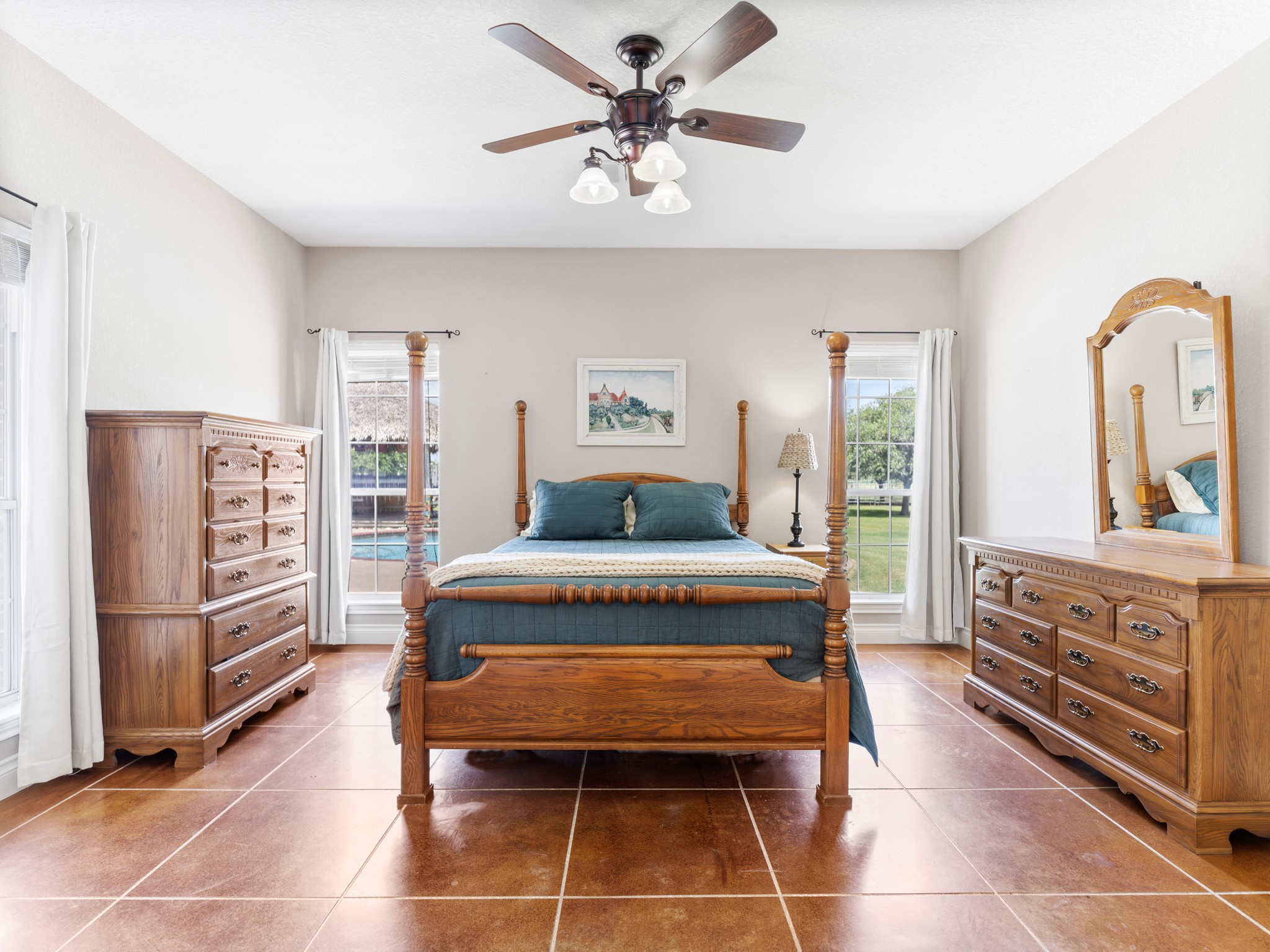 10630 Brinkmeyer Road Needville, TX 77461 - Photo 34 of 50 a bedroom with a bed and cabinets