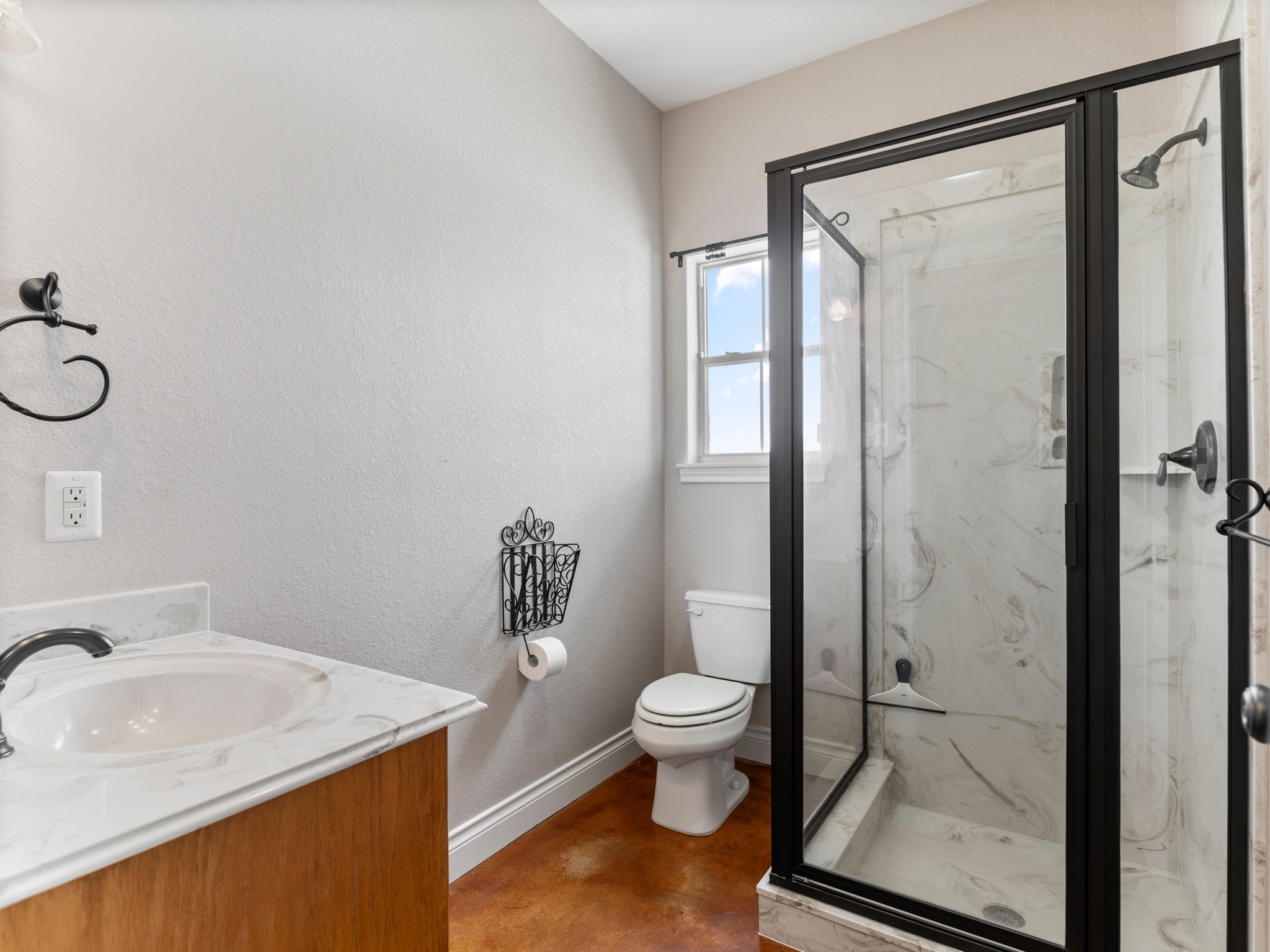 10630 Brinkmeyer Road Needville, TX 77461 - Photo 39 of 50 a bathroom with a granite countertop sink toilet and shower