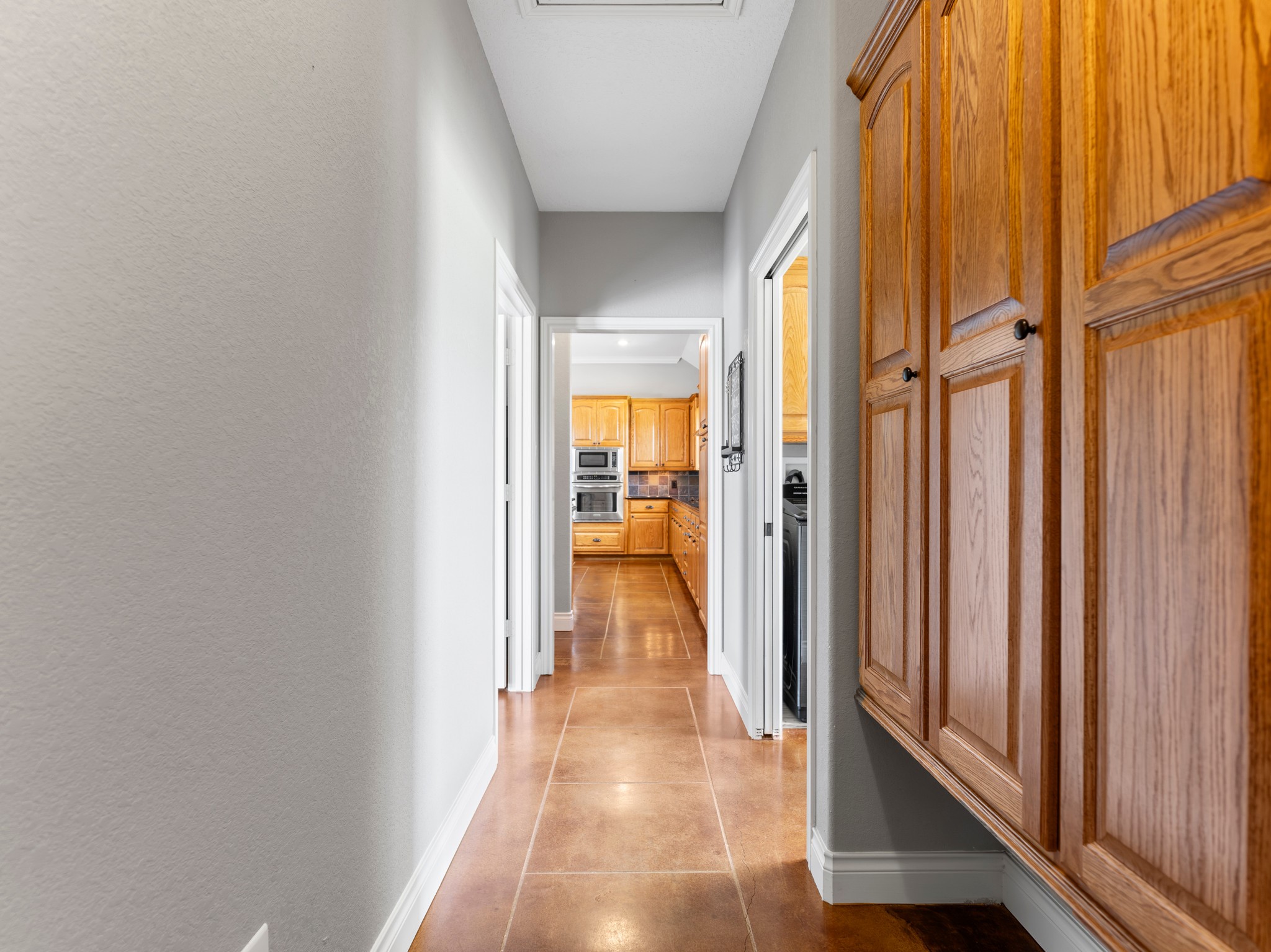 10630 Brinkmeyer Road Needville, TX 77461 - Photo 40 of 50 a view of a hallway with wooden floor and staircase