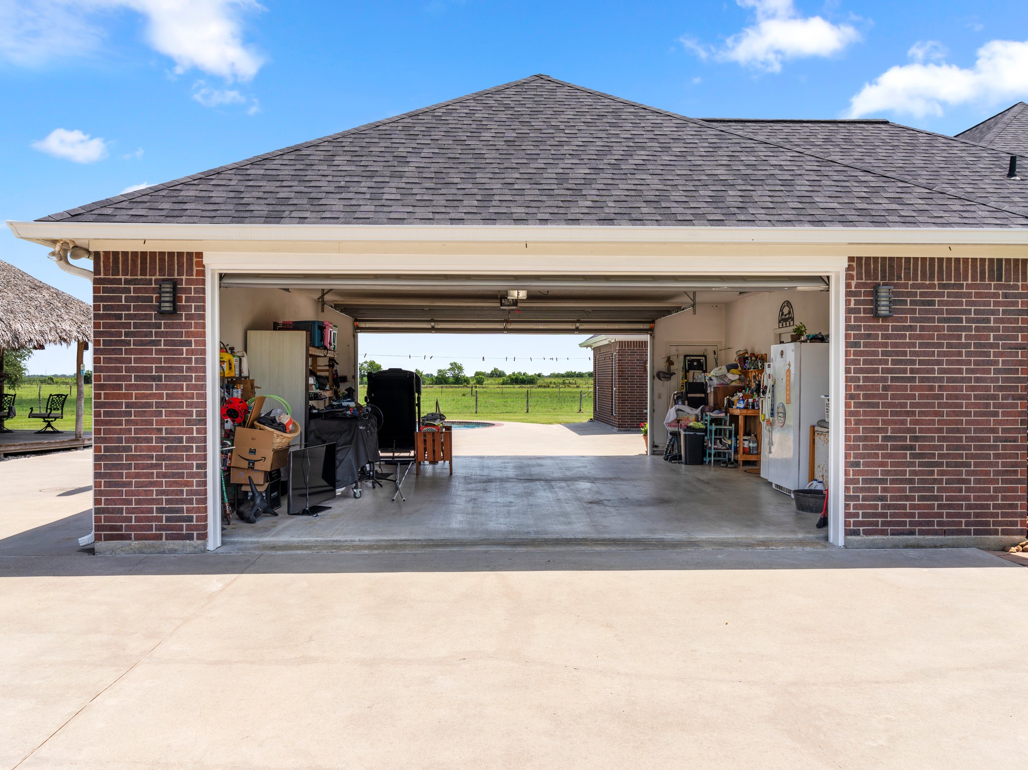 10630 Brinkmeyer Road Needville, TX 77461 - Photo 41 of 50 a view of a patio with table and chairs and potted plants