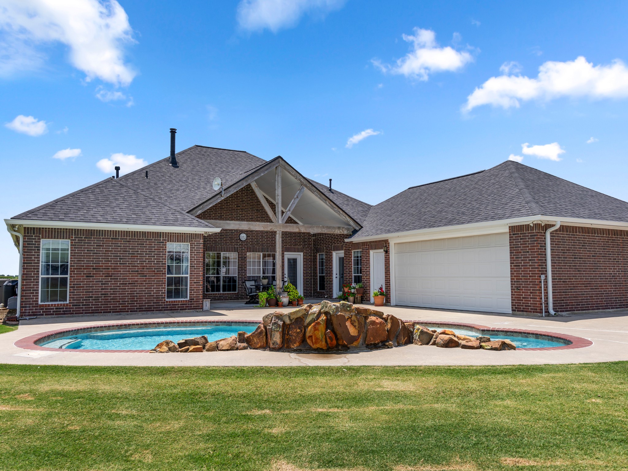 10630 Brinkmeyer Road Needville, TX 77461 - Photo 43 of 50 a view of a house with swimming pool and porch