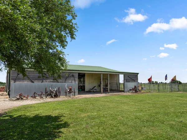 a front view of house with yard and outdoor seating
