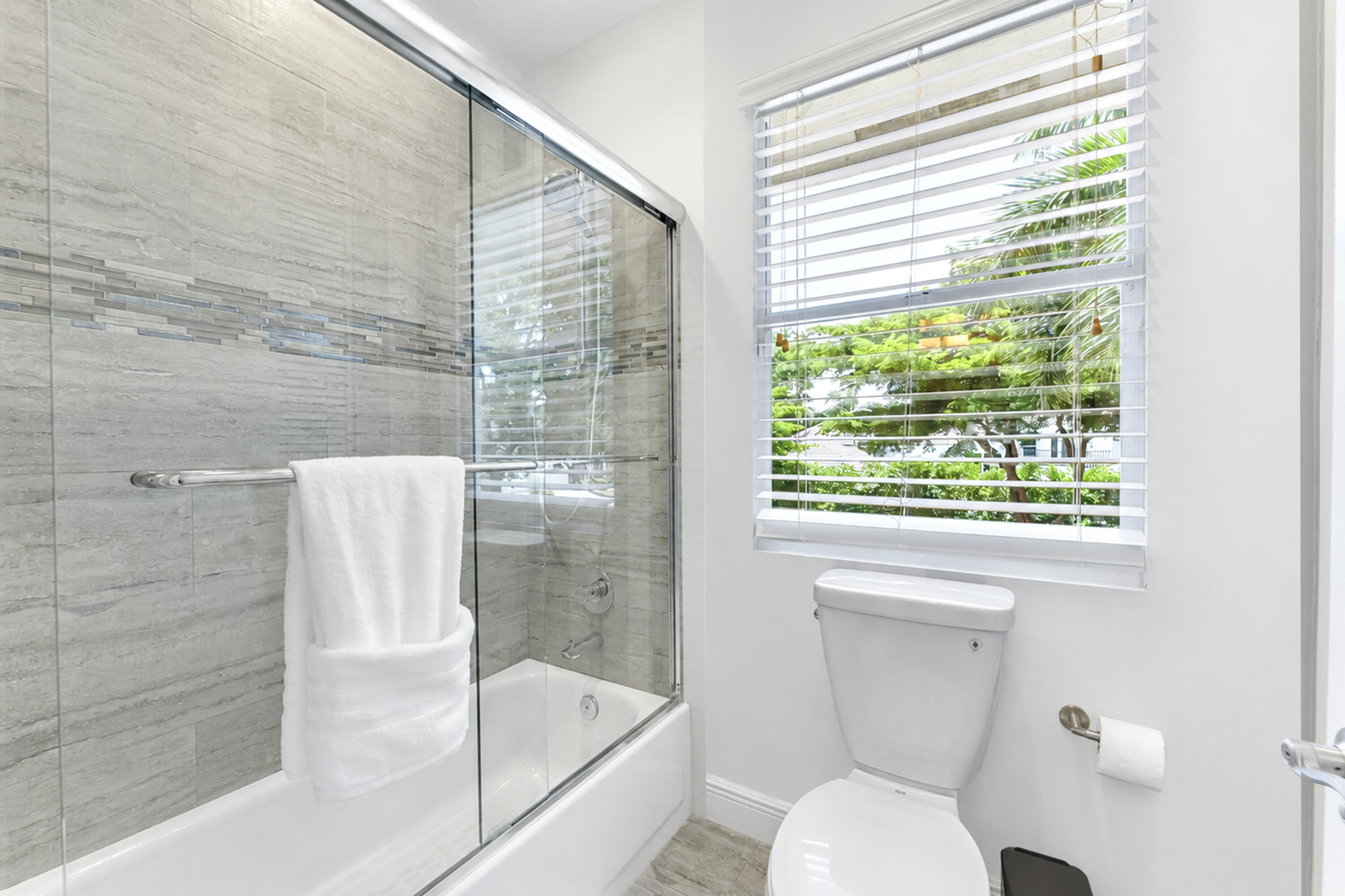 3156 Northwest 61st Street Boca Raton, FL 33496 - Photo 31 of 46 a bathroom with a toilet and a shower