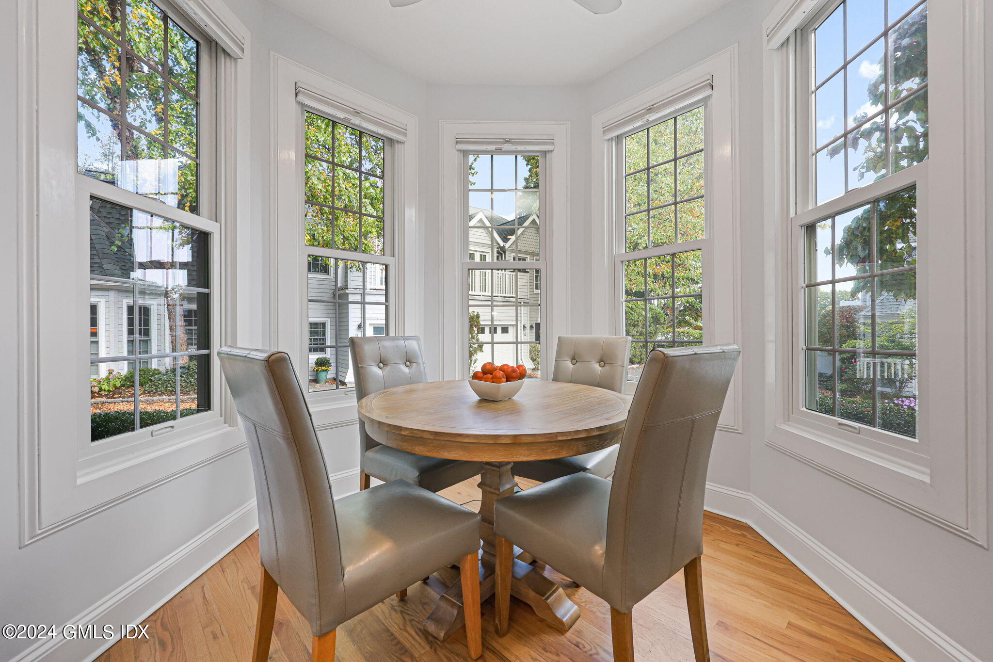 48 Spring Street, Unit 8 Greenwich, CT 06830 - Photo 15 of 24 a view of a dining room with furniture window and outside view