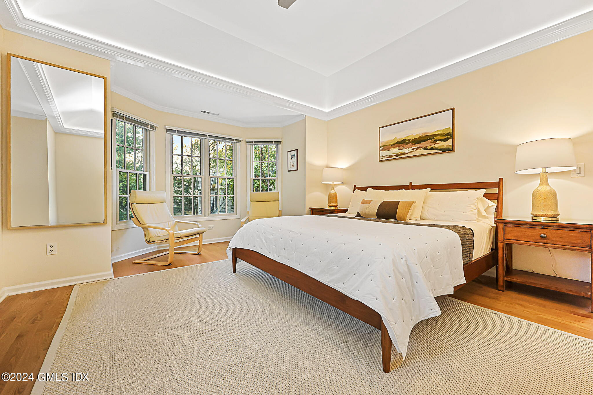 48 Spring Street, Unit 8 Greenwich, CT 06830 - Photo 16 of 24 a bedroom with a bed and large windows