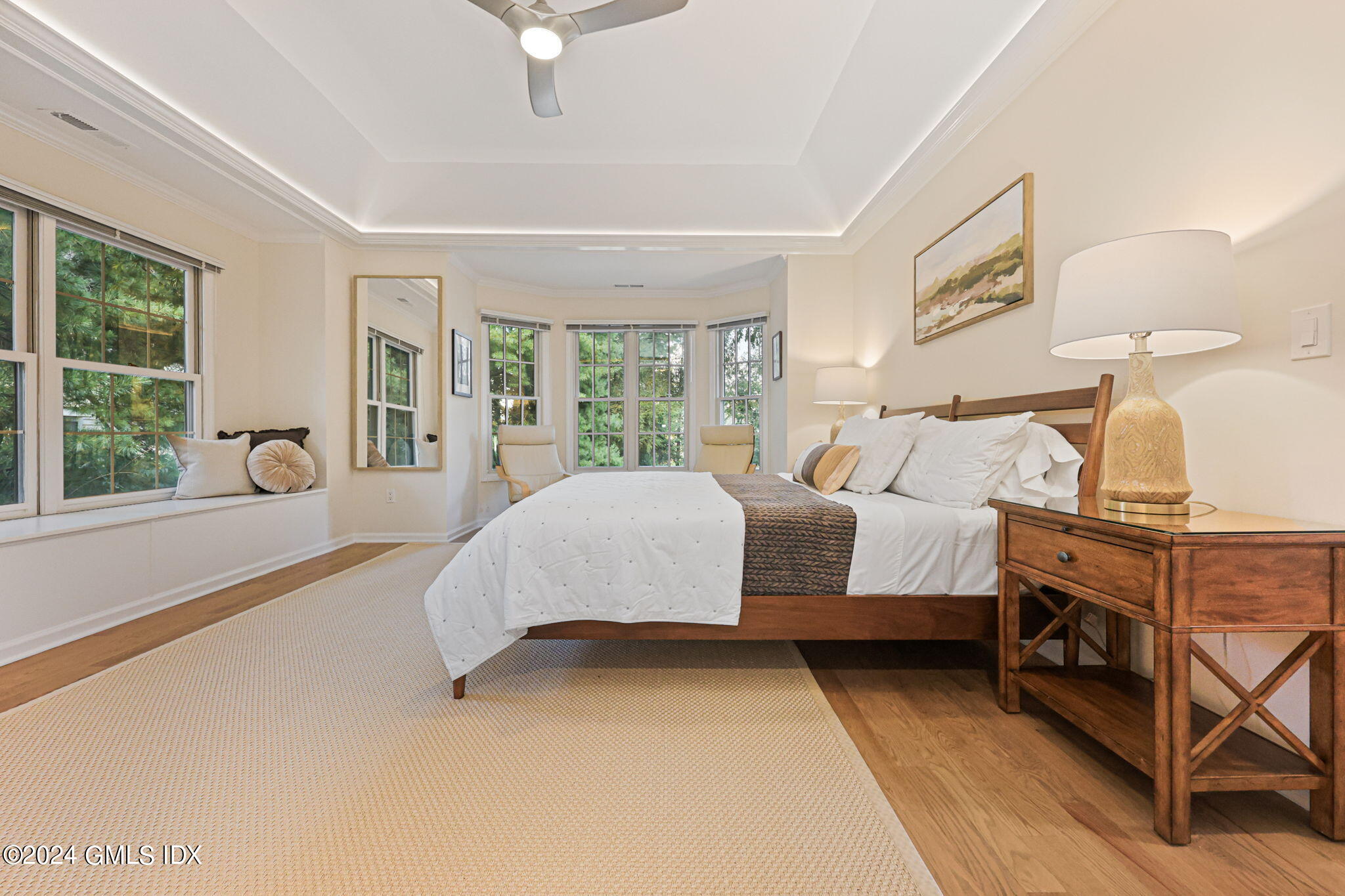 48 Spring Street, Unit 8 Greenwich, CT 06830 - Photo 17 of 24 a spacious bedroom with a bed and window