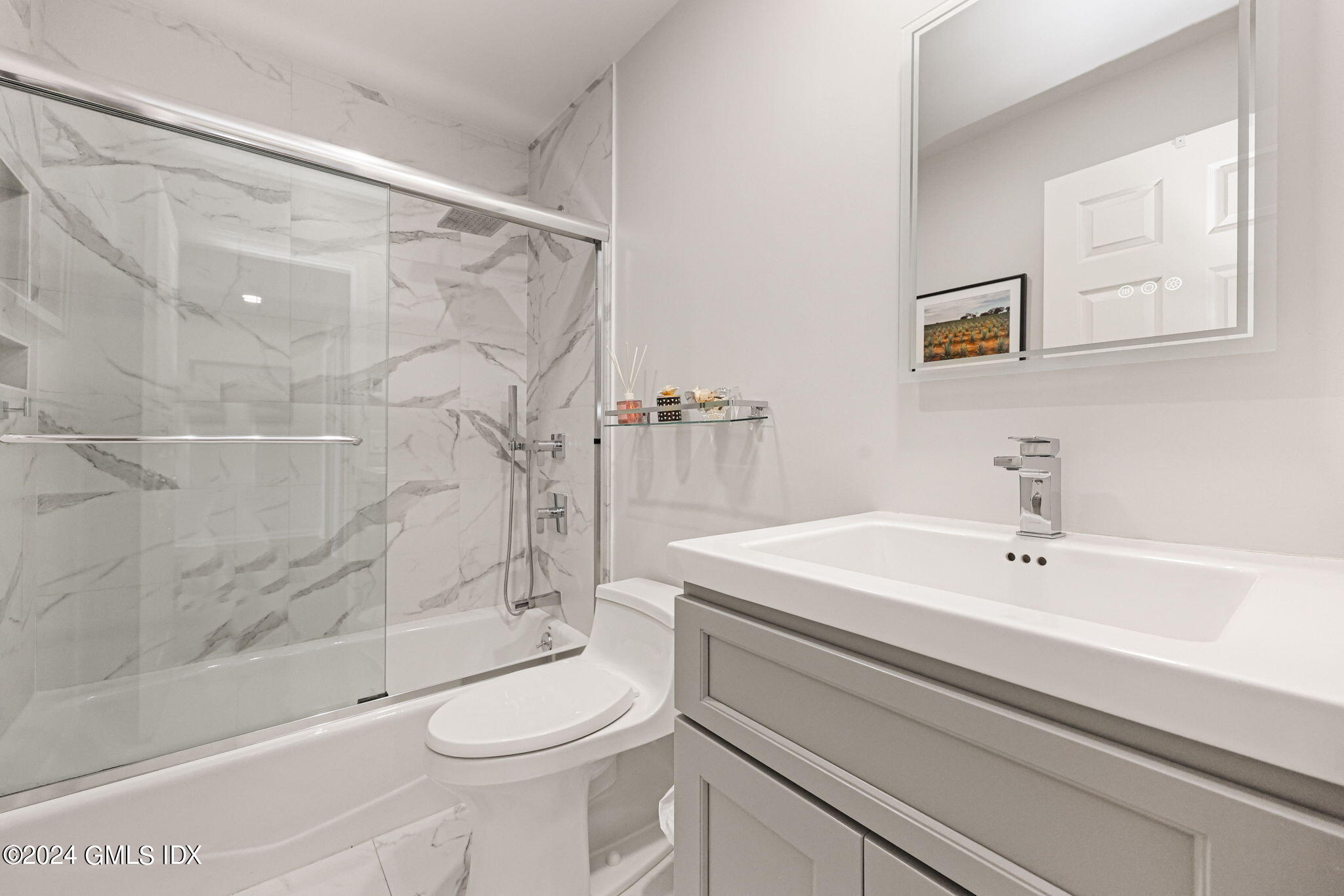 48 Spring Street, Unit 8 Greenwich, CT 06830 - Photo 22 of 24 a bathroom with a sink a toilet and shower