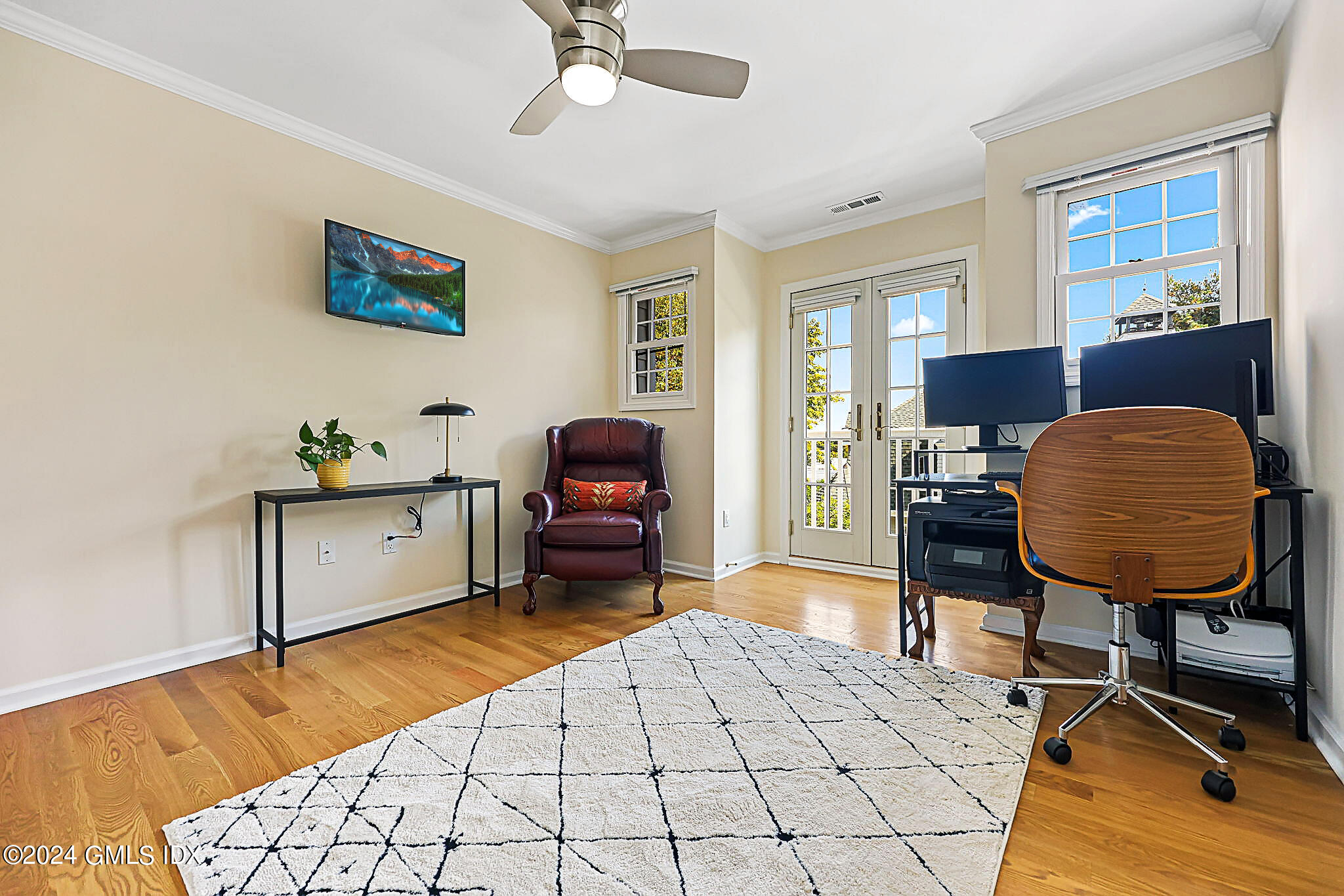 48 Spring Street, Unit 8 Greenwich, CT 06830 - Photo 23 of 24 a living room with furniture and a dining table