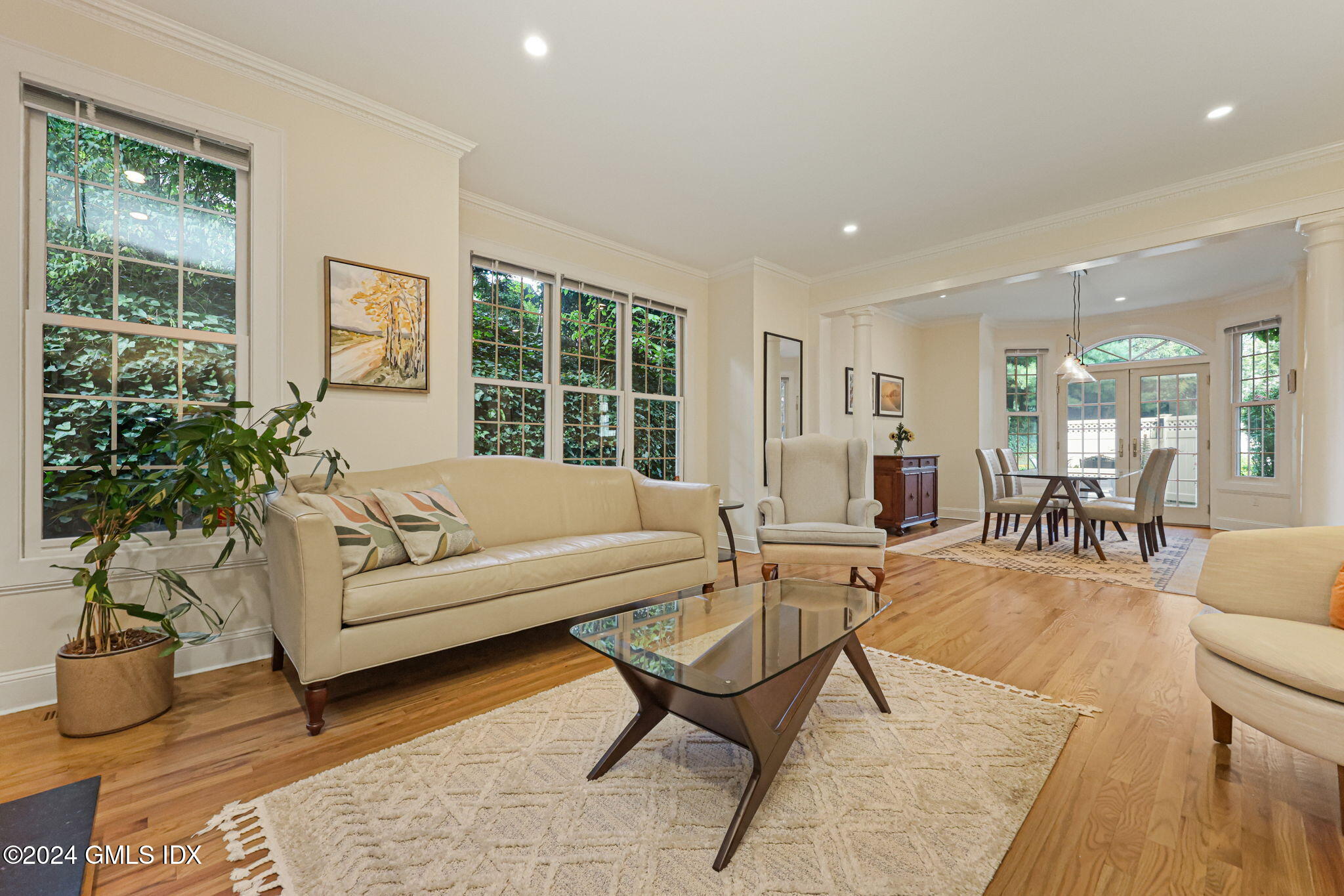 48 Spring Street, Unit 8 Greenwich, CT 06830 - Photo 6 of 24 a living room with furniture and a large window