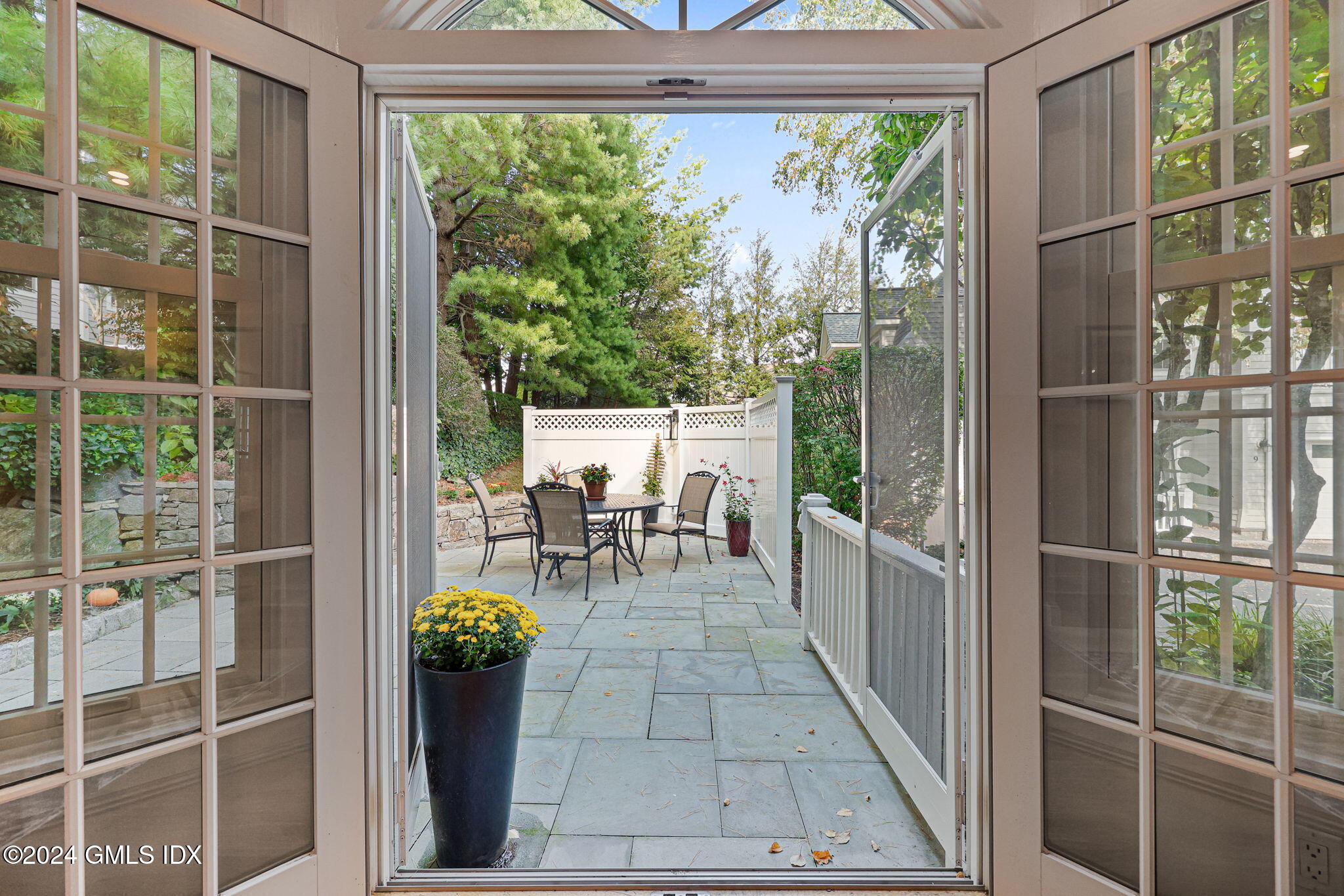 48 Spring Street, Unit 8 Greenwich, CT 06830 - Photo 8 of 24 a view of a chairs and table in a balcony