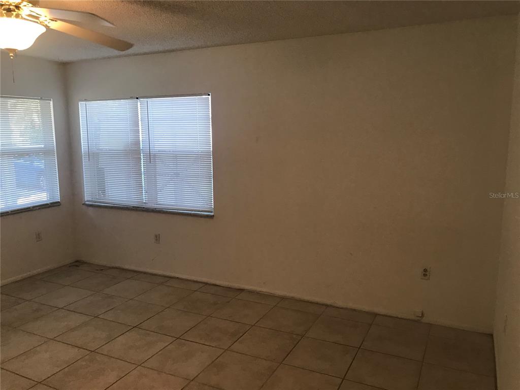 3943 Freedom Avenue, Unit 2 Sarasota, FL 34231 - Photo 11 of 15 an empty room with a window