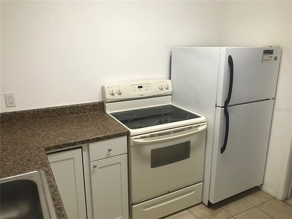 3943 Freedom Avenue, Unit 2 Sarasota, FL 34231 - Photo 7 of 15 a utility room with dryer and washer