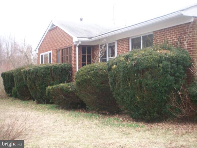 8171 Simpson Farm Road Owings, MD 20736 - Photo 1 of 5 a view of a house with a yard