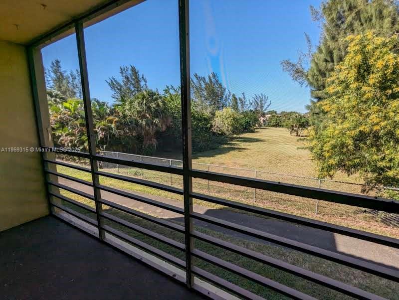 3390 Foxcroft Road, Unit C212 Miramar, FL 33025 - Photo 14 of 16 a view of a balcony with an outdoor space