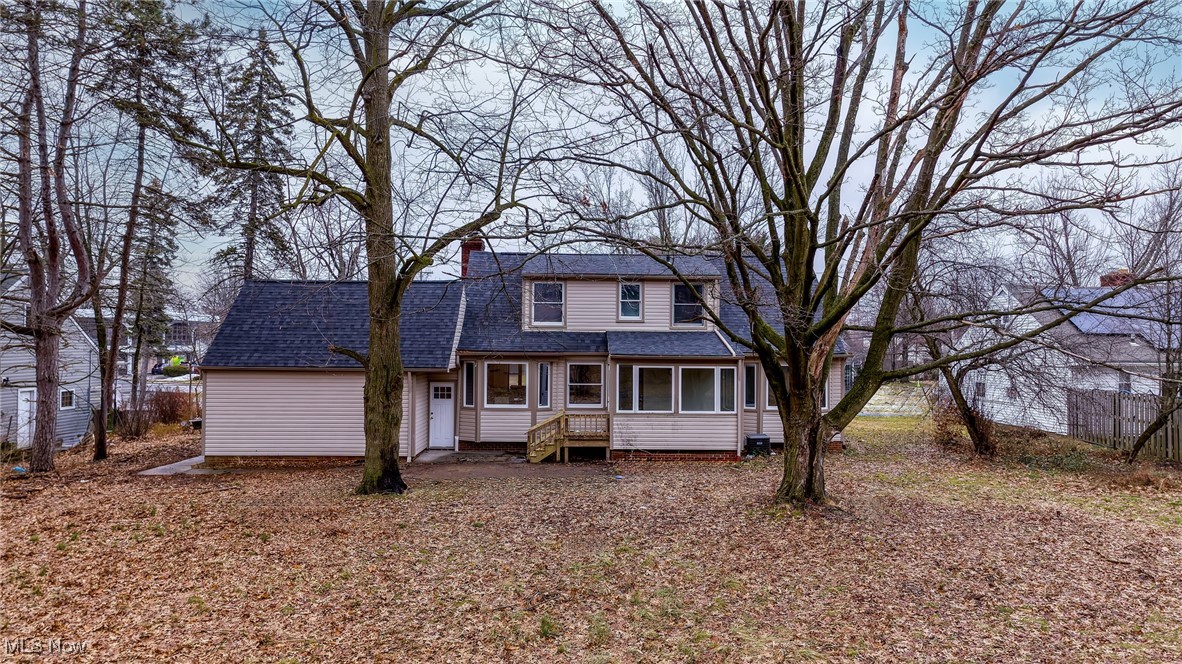 5266 Wilson Mills Road Cleveland, OH 44143 - Photo 45 of 50 Traditional-style home with a shingled roof, a sunroom, and a chimney