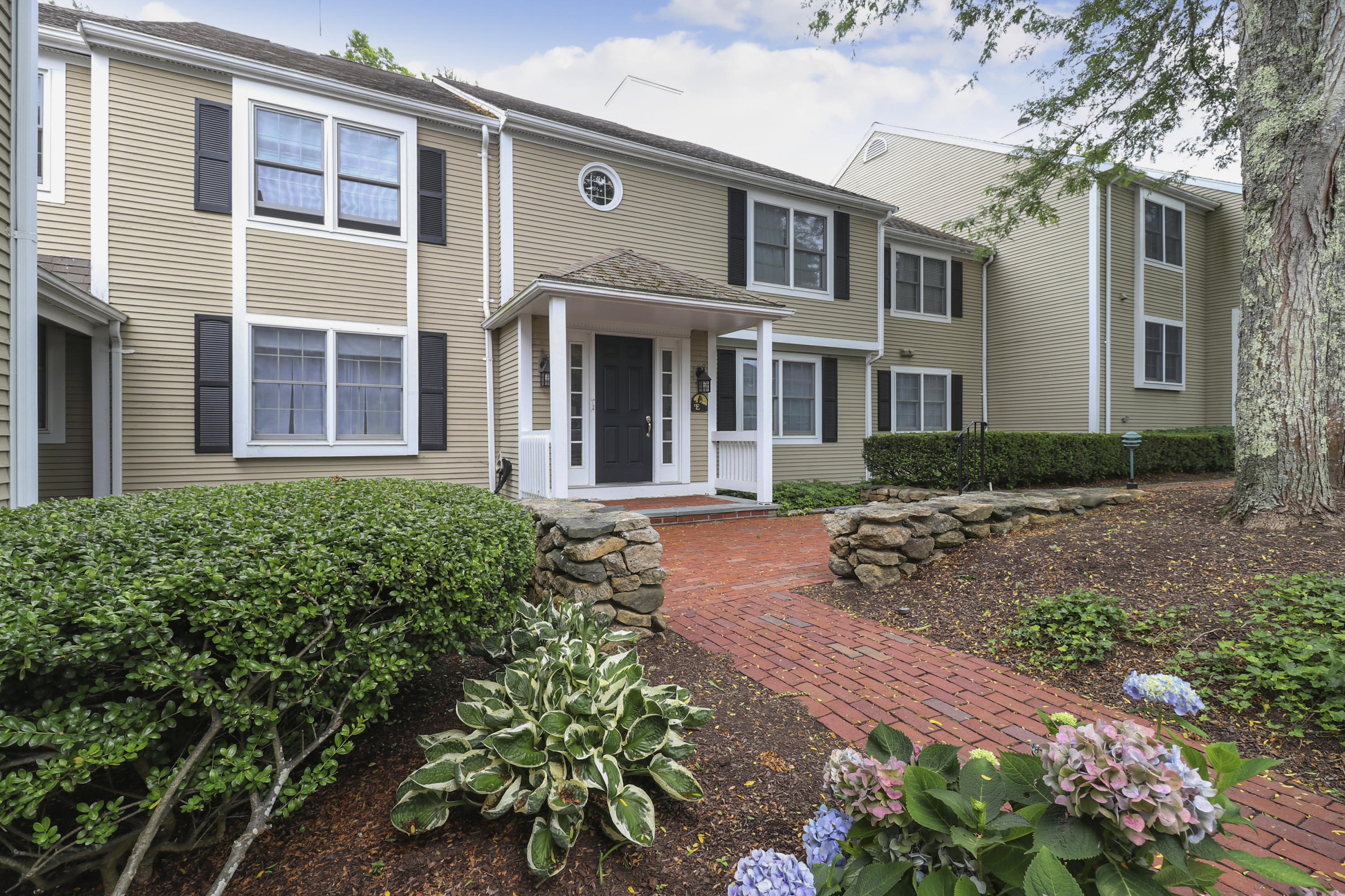 a front view of a house with garden