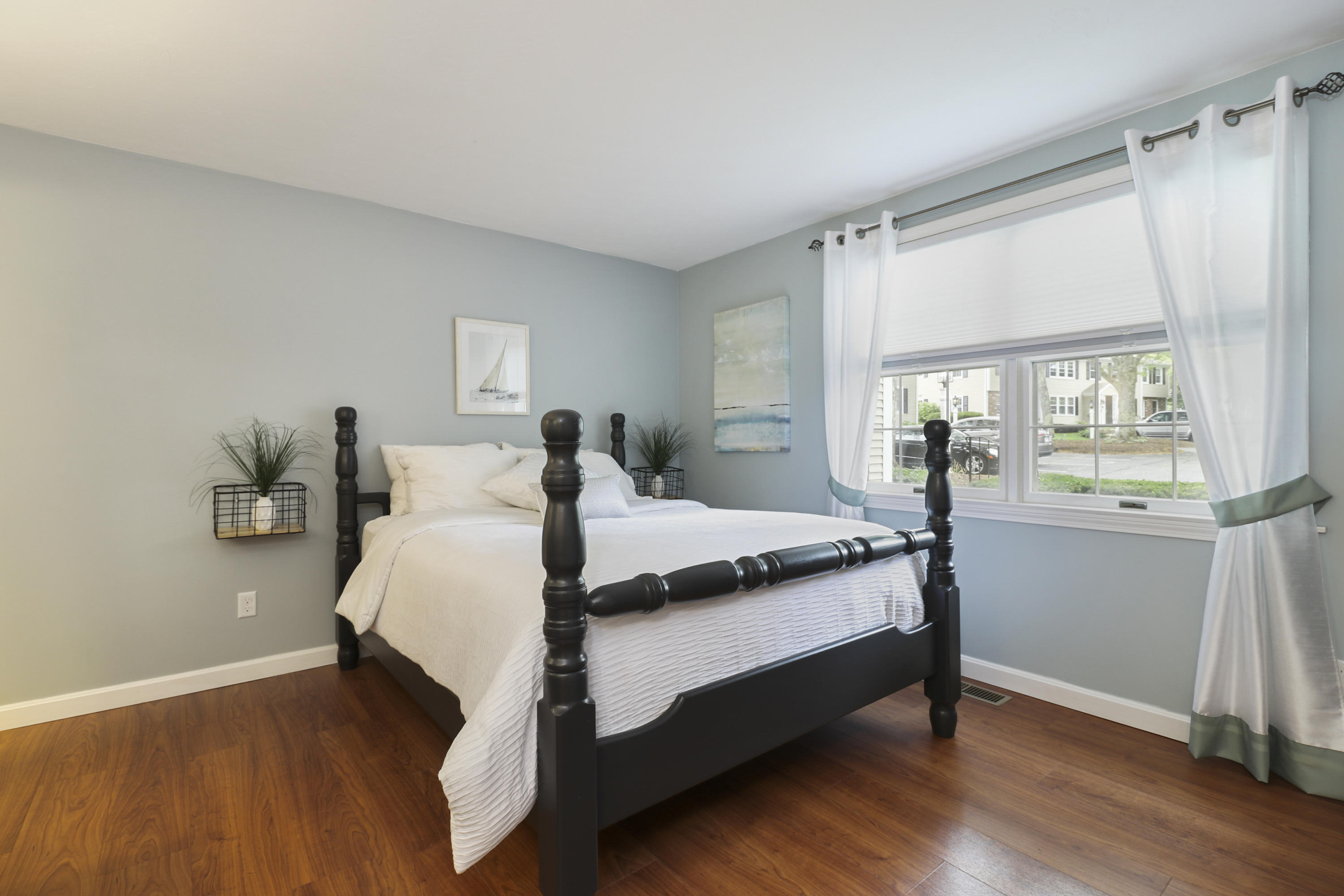 727 Main Street, Unit E1 Osterville, MA 02655 - Photo 15 of 20 a bedroom with a bed and window