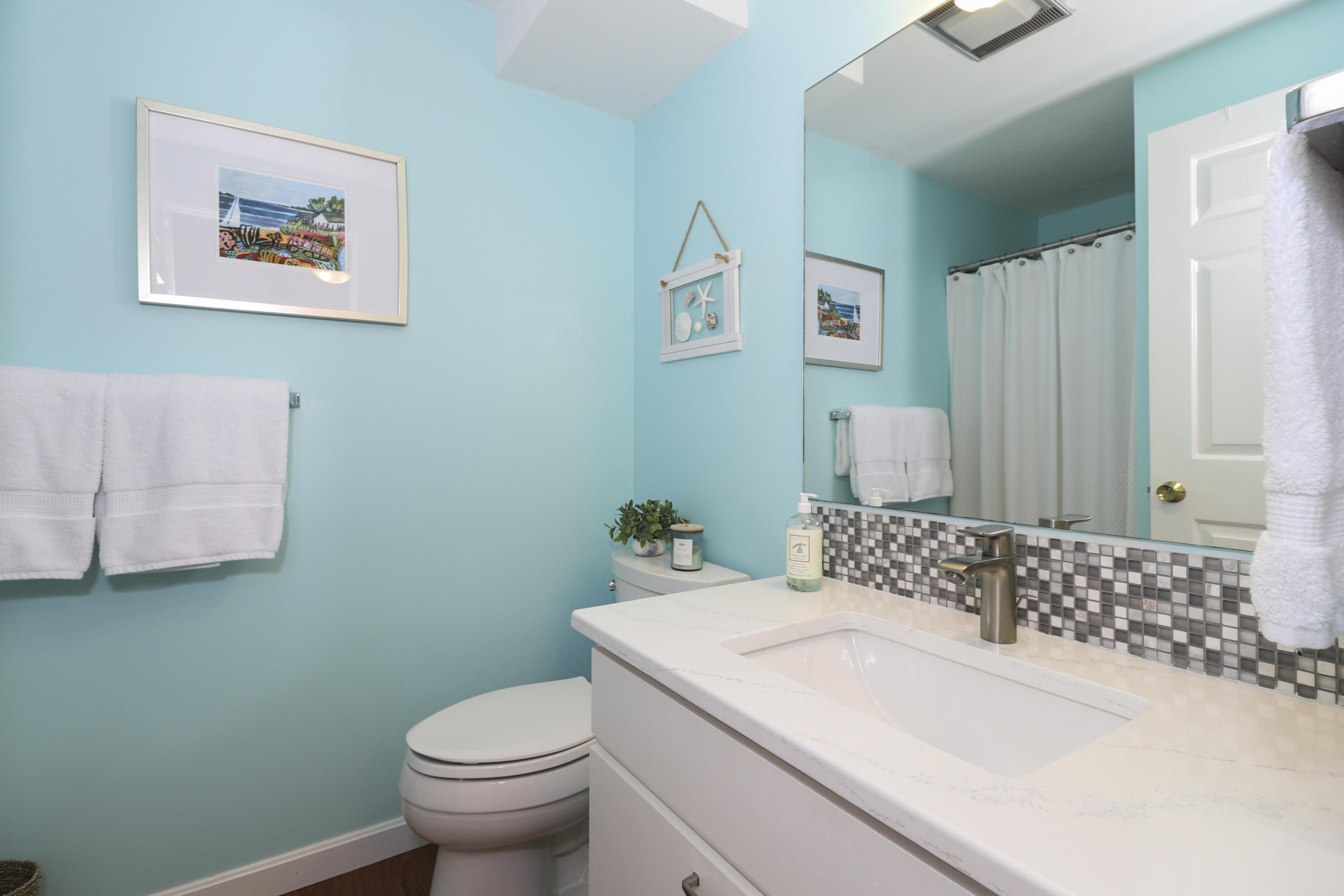 727 Main Street, Unit E1 Osterville, MA 02655 - Photo 18 of 20 a bathroom with a sink and a toilet