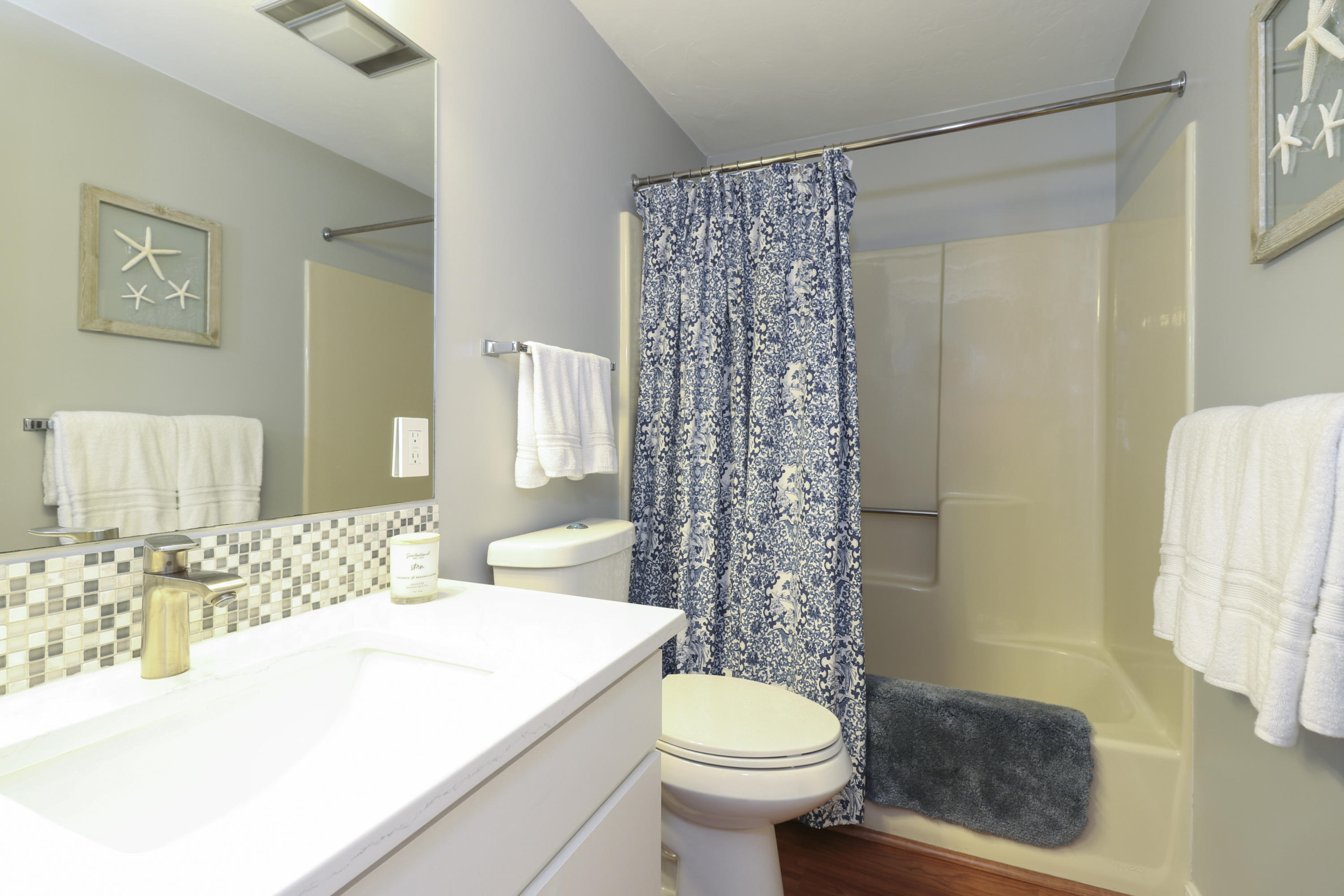 727 Main Street, Unit E1 Osterville, MA 02655 - Photo 19 of 20 a bathroom with a sink toilet and shower