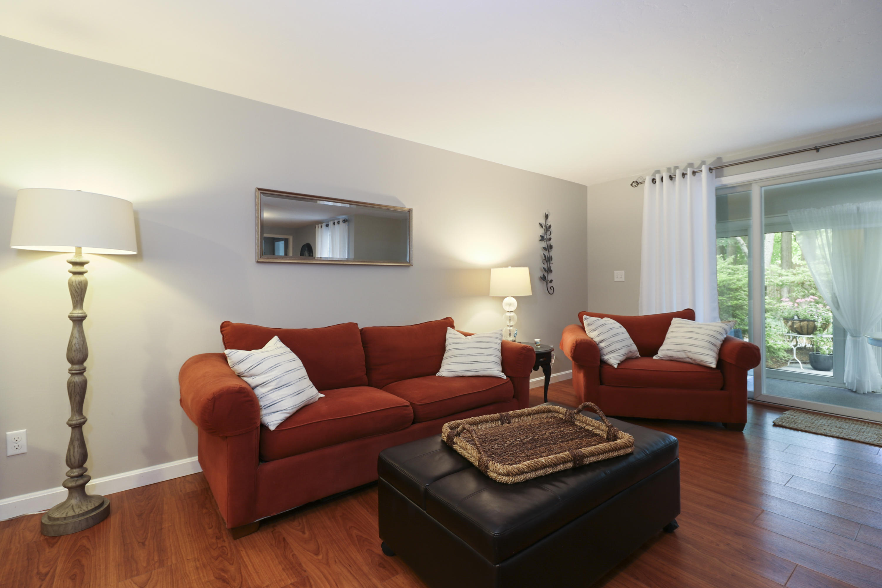 727 Main Street, Unit E1 Osterville, MA 02655 - Photo 4 of 20 a living room with furniture and a wooden floor