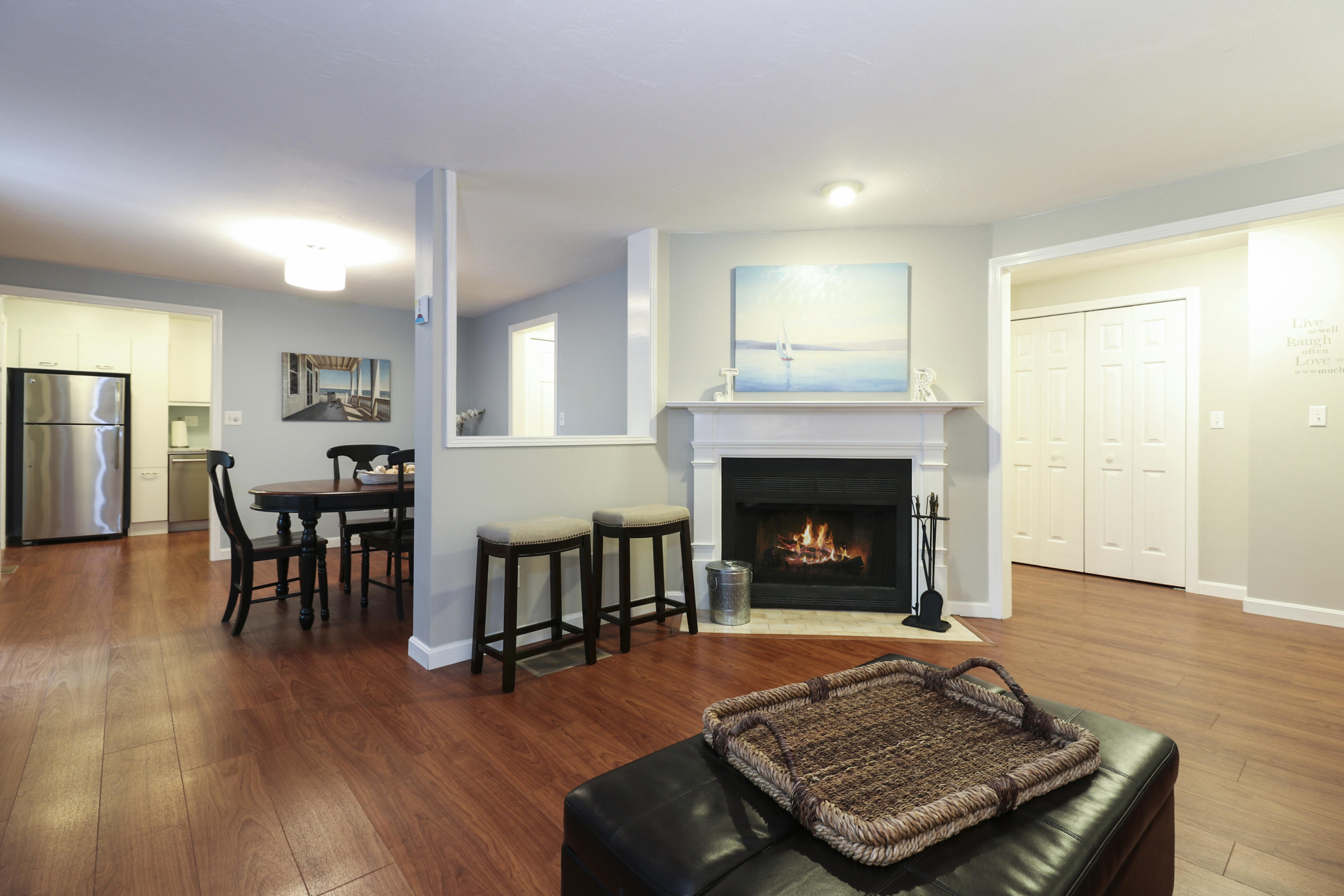 727 Main Street, Unit E1 Osterville, MA 02655 - Photo 6 of 20 a living room with furniture and a fireplace