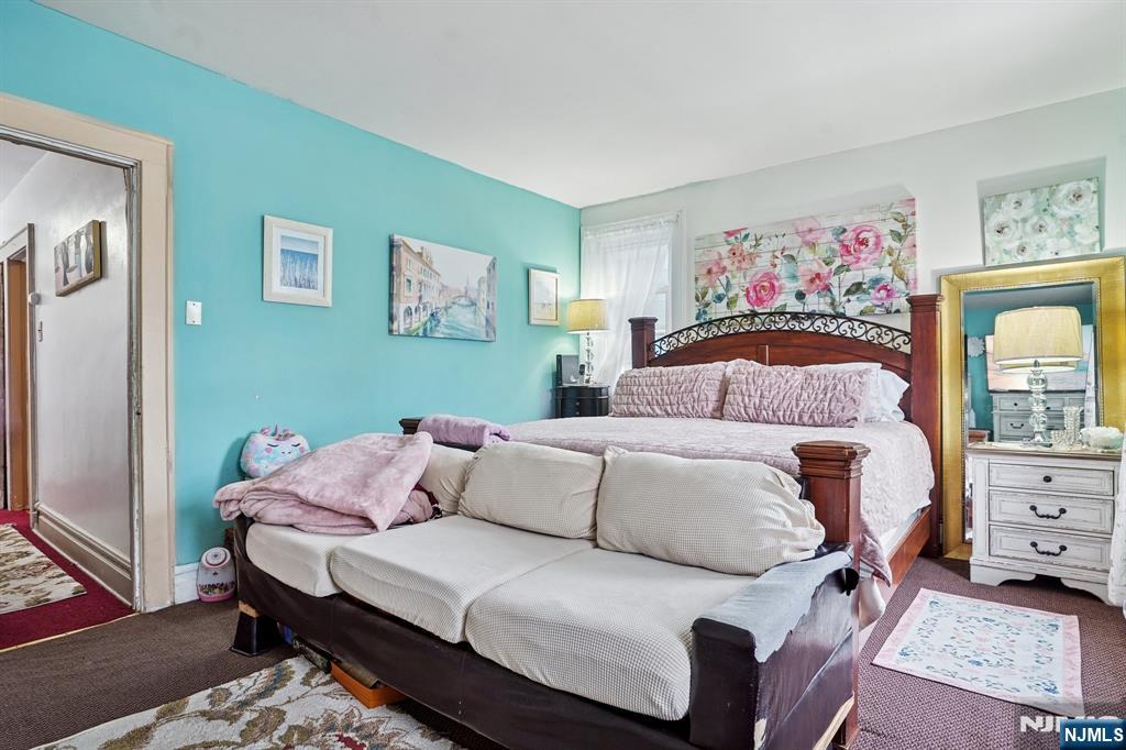 75 Coolidge Street Irvington, NJ 07111 - Photo 19 of 30 a bedroom with a bed and window