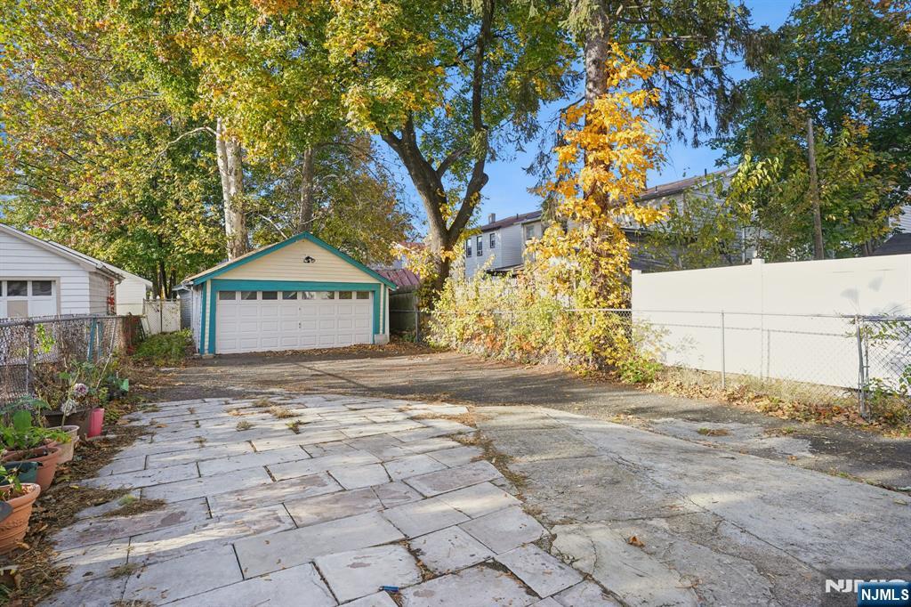 75 Coolidge Street Irvington, NJ 07111 - Photo 29 of 30 a street sign on a sidewalk next to a road