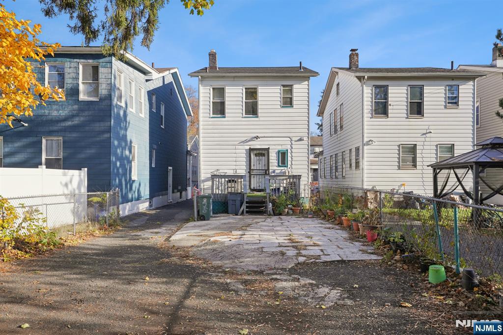 75 Coolidge Street Irvington, NJ 07111 - Photo 30 of 30 a front view of a house with a yard