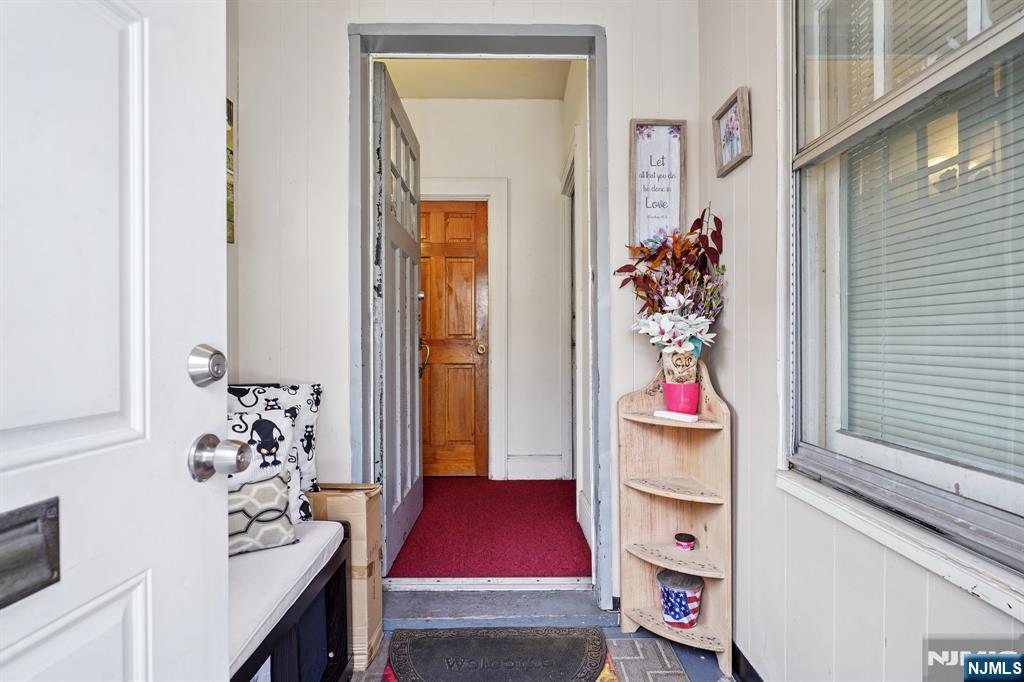 75 Coolidge Street Irvington, NJ 07111 - Photo 4 of 30 a living room with furniture and a window