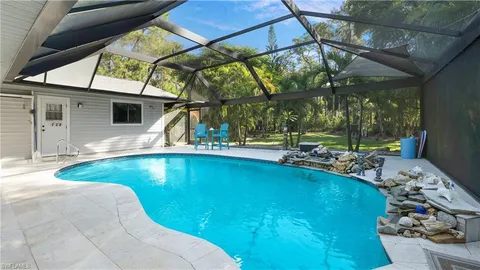 a view of swimming pool with a patio
