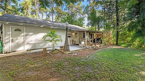 a view of a backyard with a patio