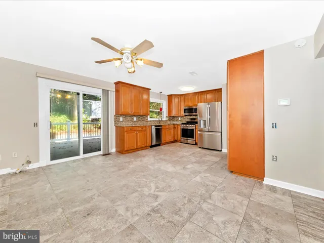 a view of a kitchen with a stove cabinets and a kitchen
