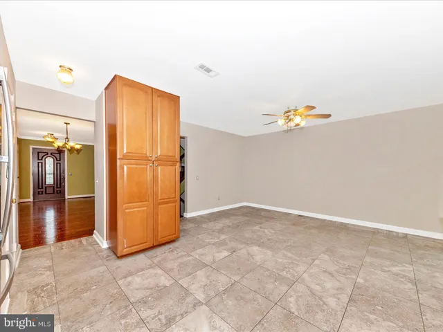 a kitchen with stainless steel appliances granite countertop a stove microwave and sink