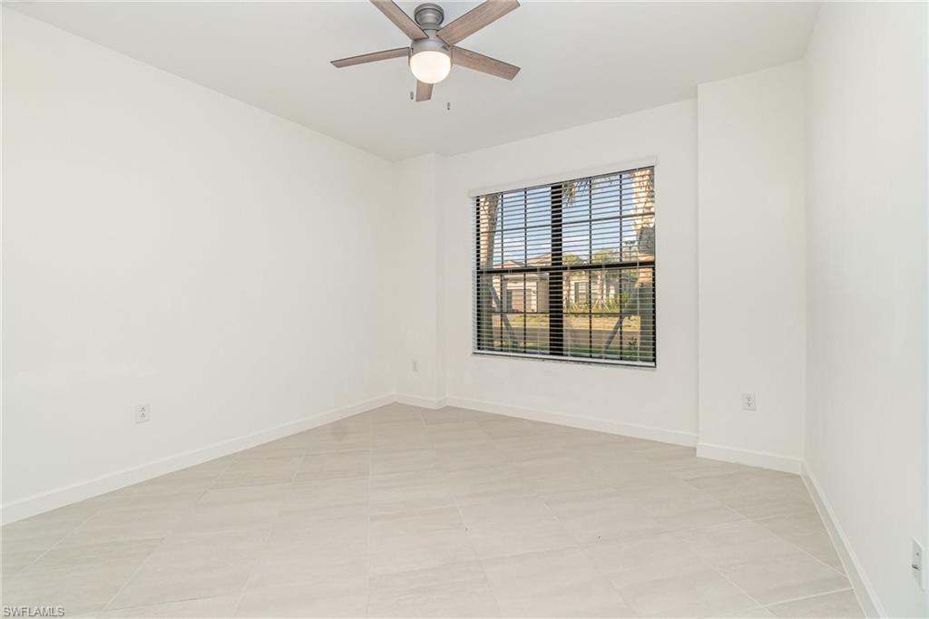 11127 Canopy Loop Fort Myers, FL 33913 - Photo 14 of 29 Empty room featuring baseboards and ceiling fan