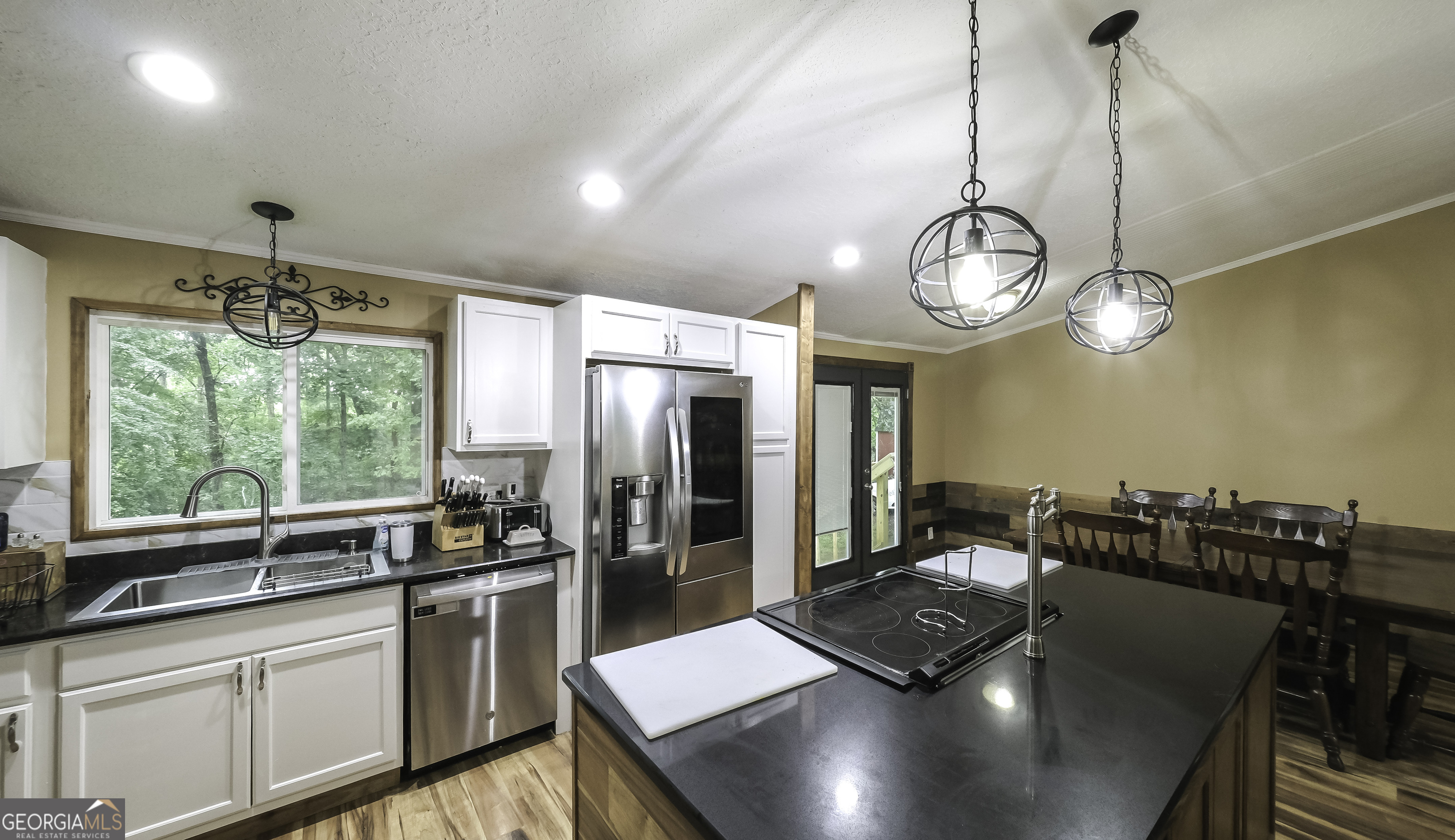91 Holder Road Temple, GA 30179 - Photo 10 of 40 a kitchen with stainless steel appliances granite countertop a sink a stove and a refrigerator