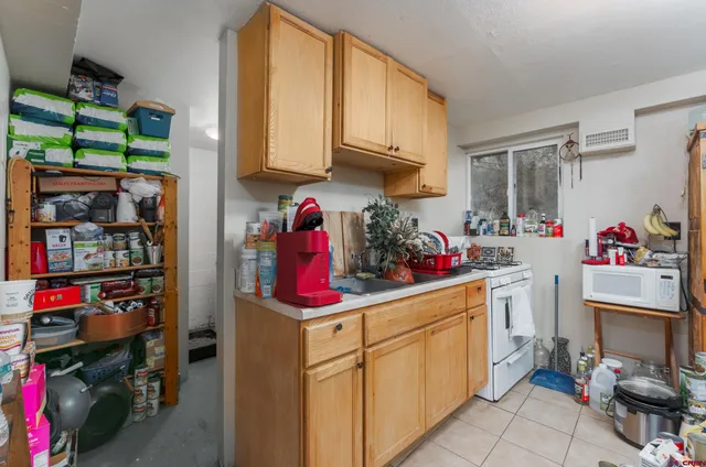 a utility room with sink washer and dryer